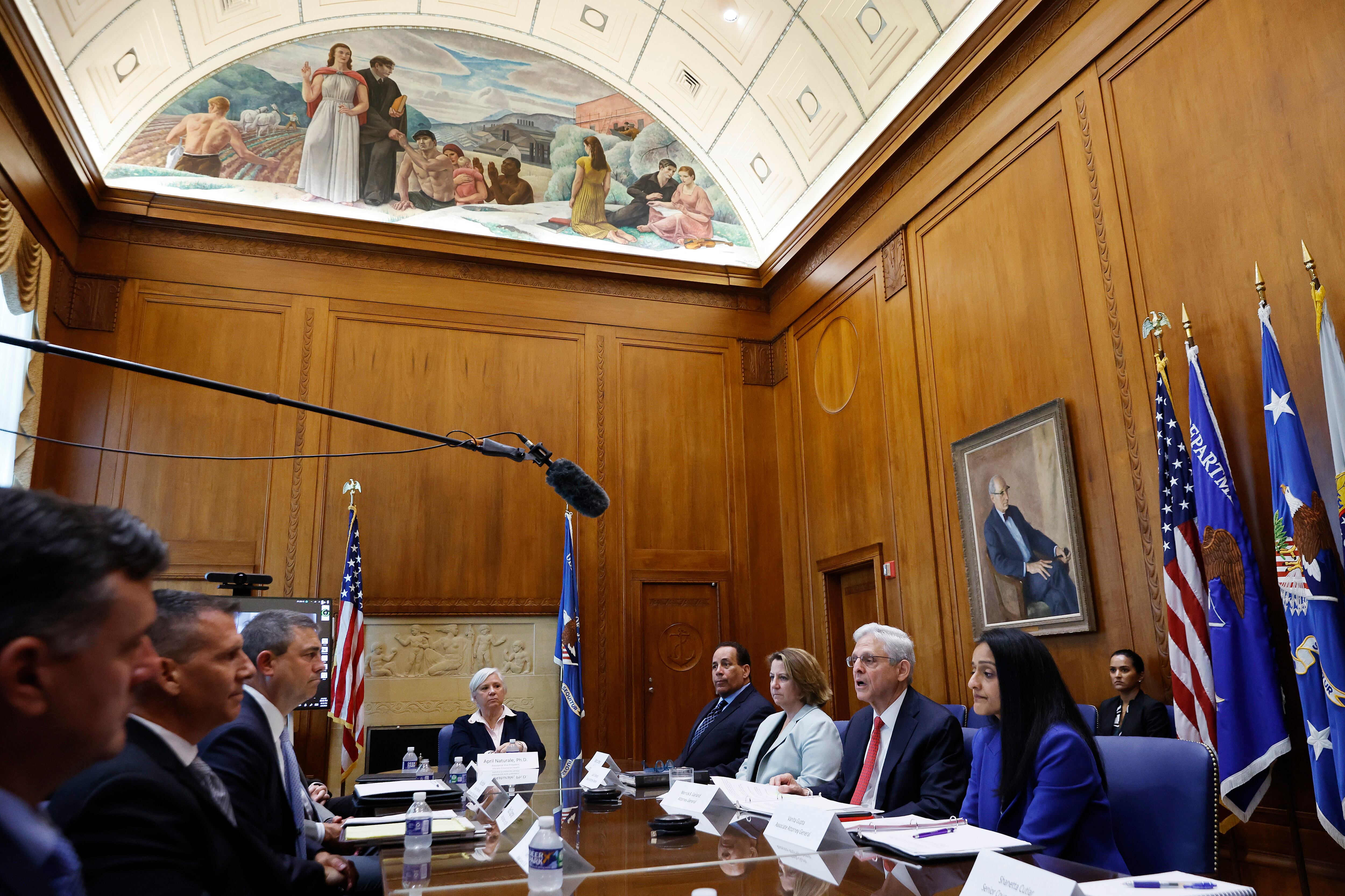 WASHINGTON, DC - JUNE 08: U.S. Attorney General Merrick Garland (3rd R) speaks to reporters before meeting with members of the team that will conduct the critical incident review of the law enforcement reaction to the mass shooting in Uvalde, Texas, at the Justice Department headquarters on June 08, 2022 in Washington, DC. The Justice Department is launching the review after it was reported that police stood just outside two classrooms as 19 school children and two teachers were massacred inside on May 24 in Uvalde. Deputy Attorney General Lisa Monaco, Associate Attorney General Vanita Gupta and Community Oriented Policing Services Acting Director Robert Chapman also attended the meeting.  (Photo by Chip Somodevilla/Getty Images)