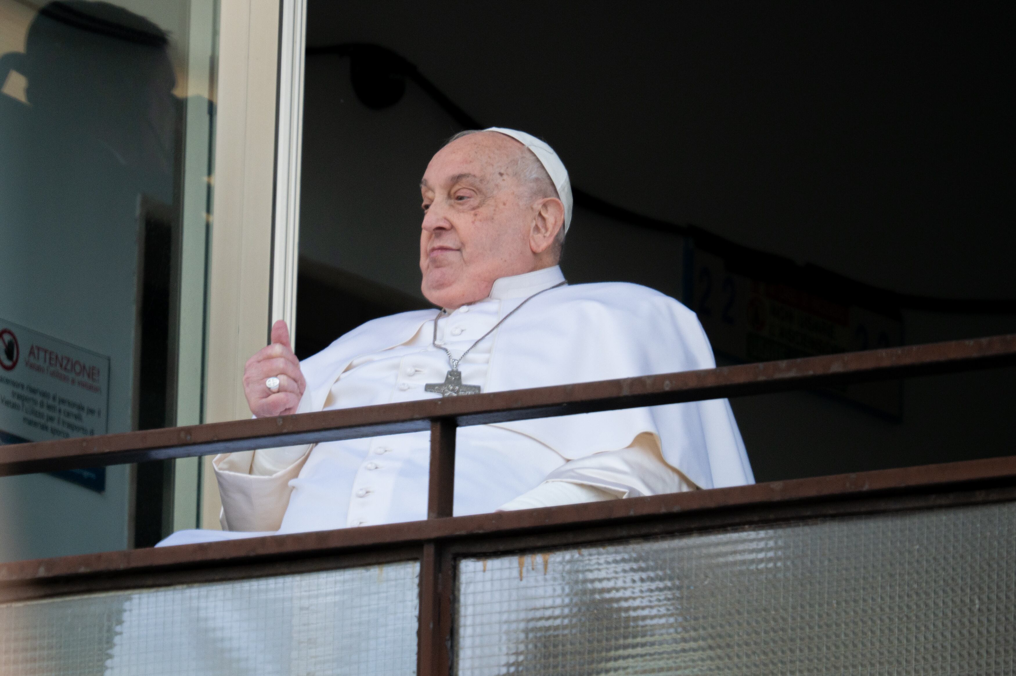 Pope Francis appears at a window of the Gemelli hospital before being discharged following a five-week hospitalization for pneumonia in Rome, Italy, on March 23, 2025. (Photo by Massimo Valicchia/NurPhoto via Getty Images)
