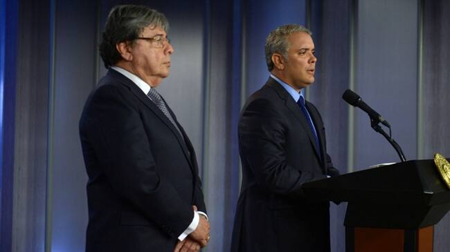 El canciller Carlos Holmes y el presidente Iván Duque. Foto: Presidencia