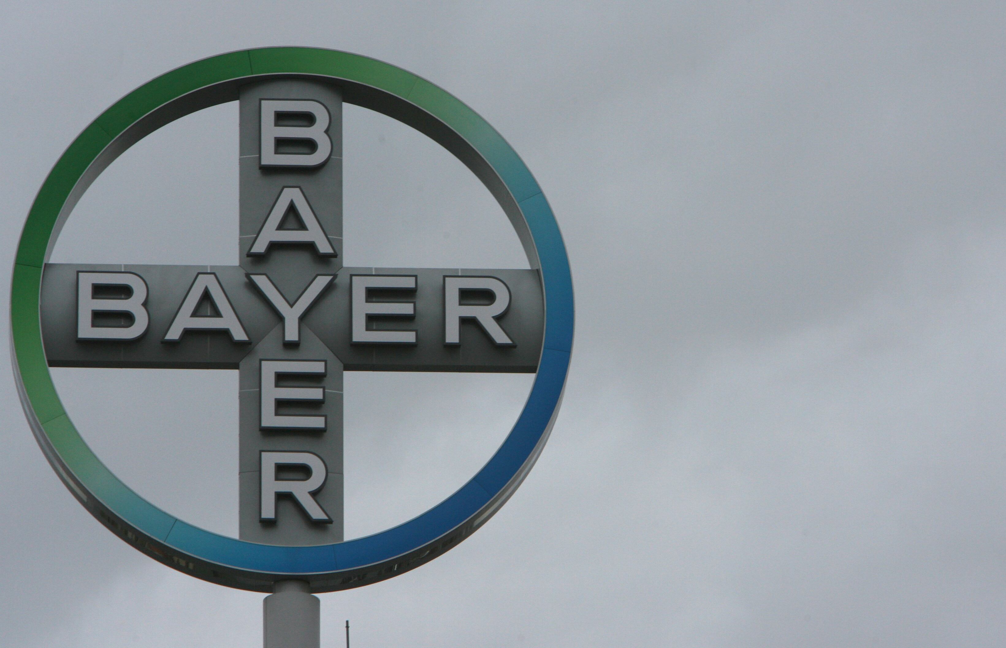 FILES - A picture taken 14 November 2006 shows a revolving Bayer logo on a building in Berlin. Six years after it was hit by problems with the anticholesterol drug Lipobay/Baycol, German chemicals and pharmaceutical group Bayer said 05 November 2007 it would suspend global sales of its antibleeding treatment Trasylol.  AFP PHOTO JOHN MACDOUGALL (Photo by John MACDOUGALL / AFP) (Photo by JOHN MACDOUGALL/AFP via Getty Images)