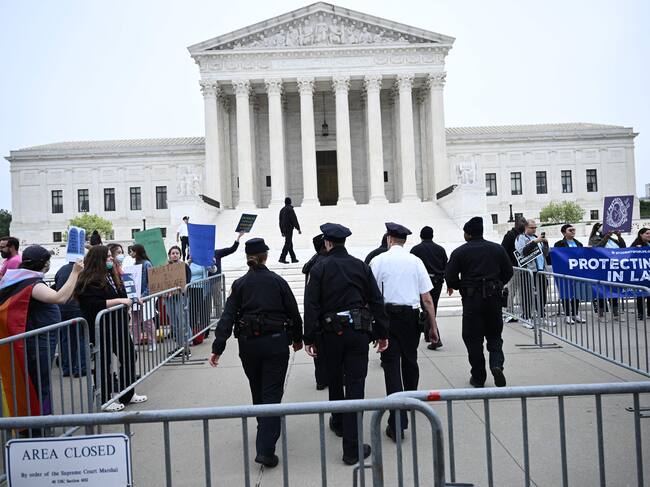 Pro-life and pro-choice demonstrators gather in front of the US Supreme Court in Washington, DC, on May 3, 2022. - The Supreme Court is poised to strike down the right to abortion in the US, according to a leaked draft of a majority opinion that would shred nearly 50 years of constitutional protections. The draft, obtained by Politico, was written by Justice Samuel Alito, and has been circulated inside the conservative-dominated court, the news outlet reported. Politico stressed that the document it obtained is a draft and opinions could change. The court is expected to issue a decision by June. The draft opinion calls the landmark 1973 Roe v Wade decision "egregiously wrong from the start." (Photo by Brendan SMIALOWSKI / AFP) (Photo by BRENDAN SMIALOWSKI/AFP via Getty Images)