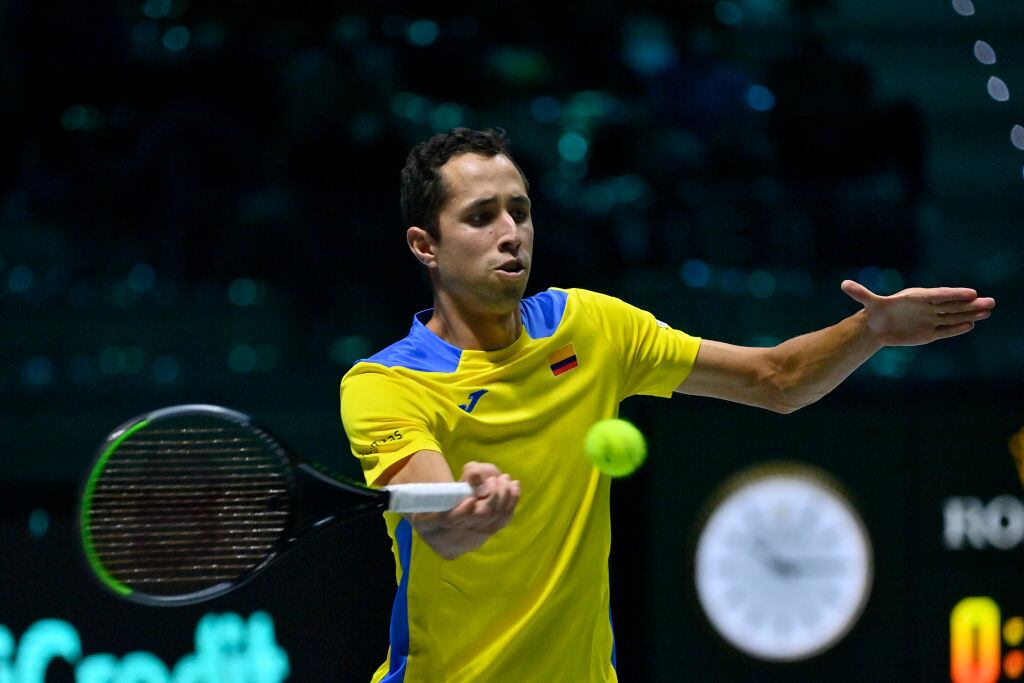 TURIN, ITALY - NOVEMBER 27: Daniel Galán of Colombia  in action against Jannik Sinner of Italy during the Italy v Colombia match on Davis Cup Finals 2021 at Pala Alpitour on November 27, 2021 in Turin, Italy. (Photo by Stefano Guidi/Getty Images)