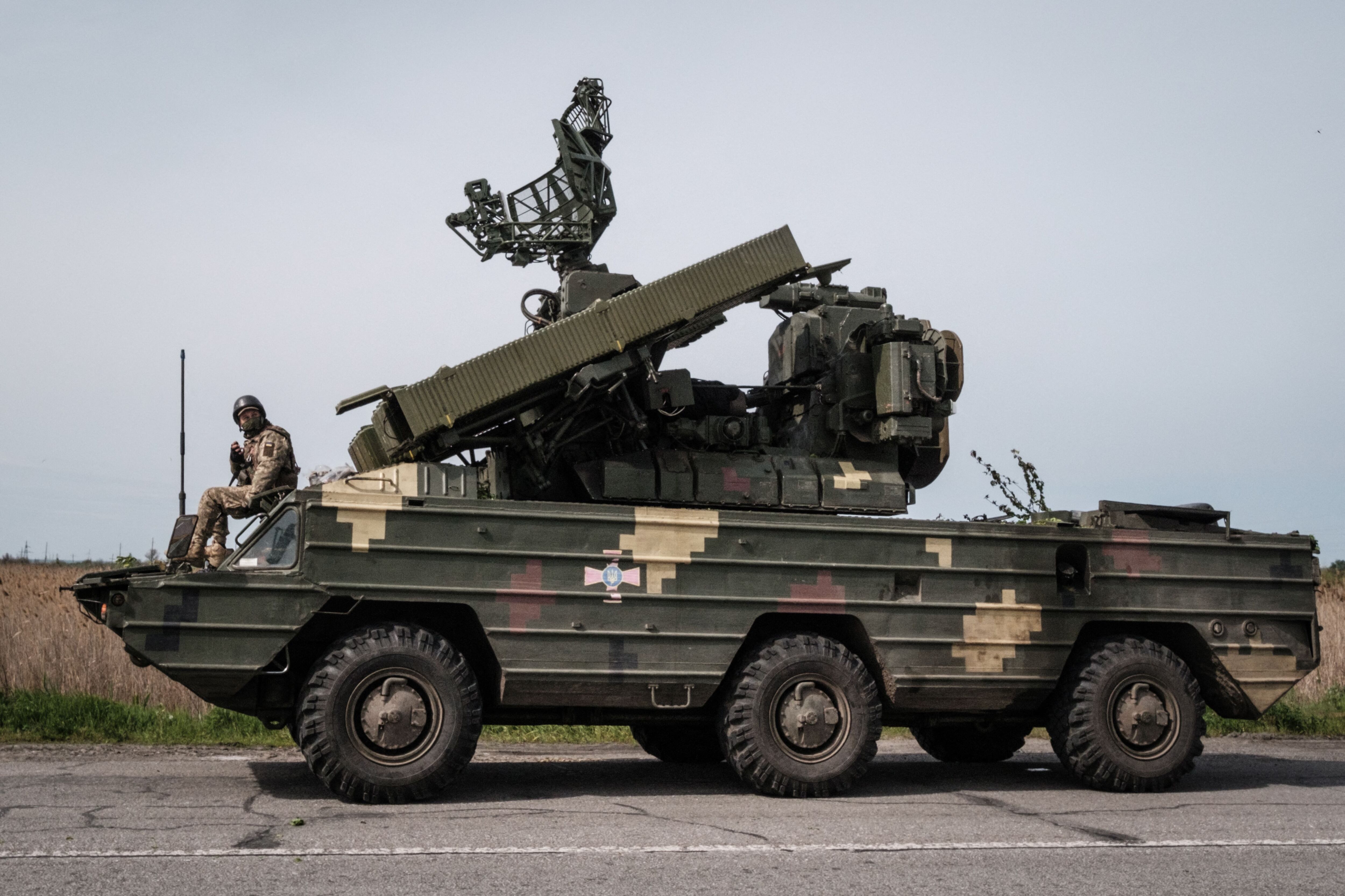 A Ukrainian soldier sits on an anti aircraft missile system near Sloviansk, eastern Ukraine on May 11, 2022, amid the Russian invasion of Ukraine. (Photo by Yasuyoshi CHIBA / AFP) (Photo by YASUYOSHI CHIBA/AFP via Getty Images)