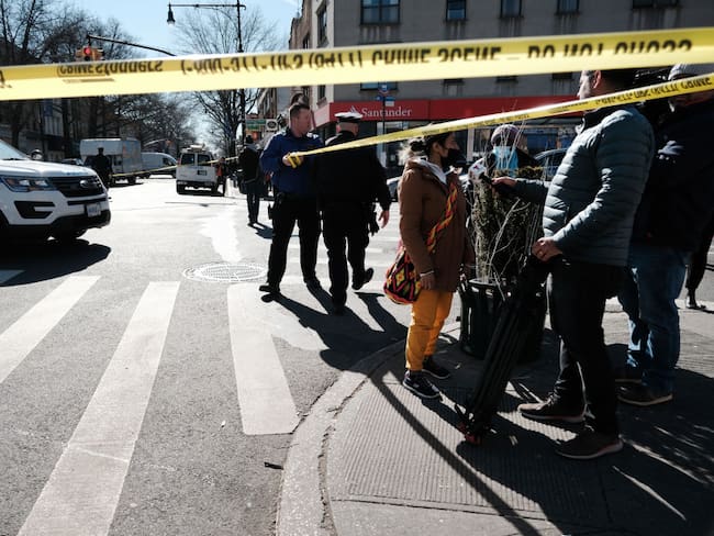 NEW YORK, NEW YORK - FEBRUARY 13: Police investigate at an intersection after a man driving (Photo by Spencer Platt/Getty Images)