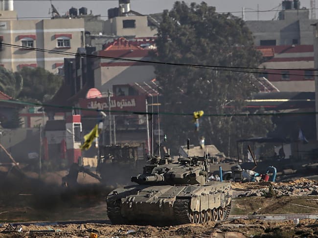 Khan Younis (---), 26/01/2024.- Israeli tanks patrol the streets during a military operation in Khan Younis, southern Gaza Strip, 26 January 2024 (issued 27 January 2024). At least 26,000 Palestinians and at least 1,330 Israelis have been killed, according to the Palestinian Health Ministry and the Israel Defense Forces (IDF), since Hamas militants launched an attack against Israel from the Gaza Strip on 07 October 2023, and the Israeli operations in Gaza and the West Bank which followed it. EFE/EPA/MOHAMMED SABER