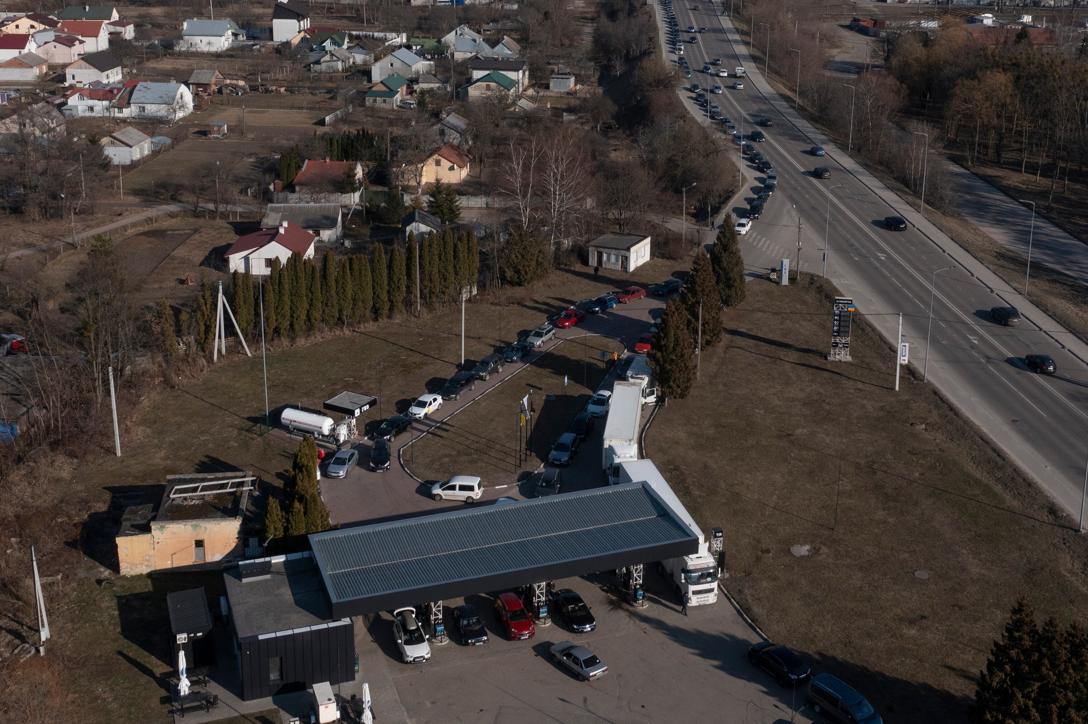 LVIV, UKRAINE - MARCH 13: A large queue forms at a petrol station as many garages across the city have run out of fuel on March 13, 2022 in Lviv, Ukraine. In recent days, Russia has escalated its offensive across western Ukraine, including air strikes on a military training complex west of Lviv, in a part of the country that has thus far been spared the brunt of Russia's attack. (Photo by Dan Kitwood/Getty Images)