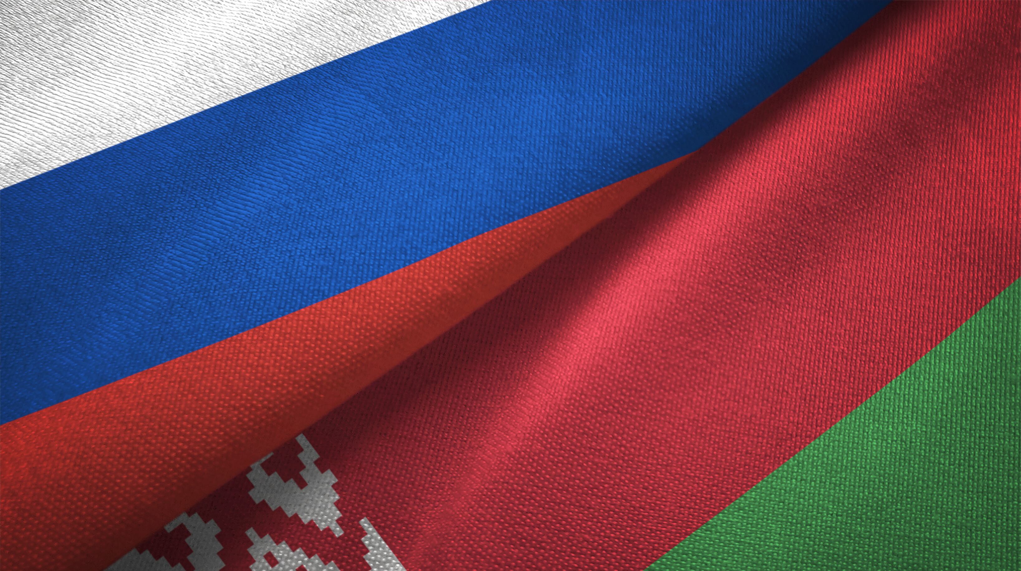 Belarus and Russia flag together realtions textile cloth fabric texture