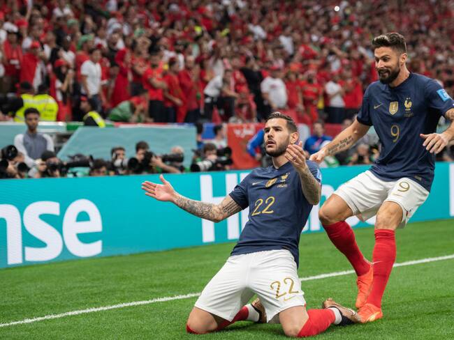 AL KHOR, QATAR - DECEMBER 14: Theo Hernandez of France (L) celebrates scoring the opening goal with Olivier Giroud of France (R) during the FIFA World Cup Qatar 2022 semi final match between France and Morocco at Al Bayt Stadium on December 14, 2022 in Al Khor, Qatar. (Photo by Sebastian Frej/MB Media/Getty Images)