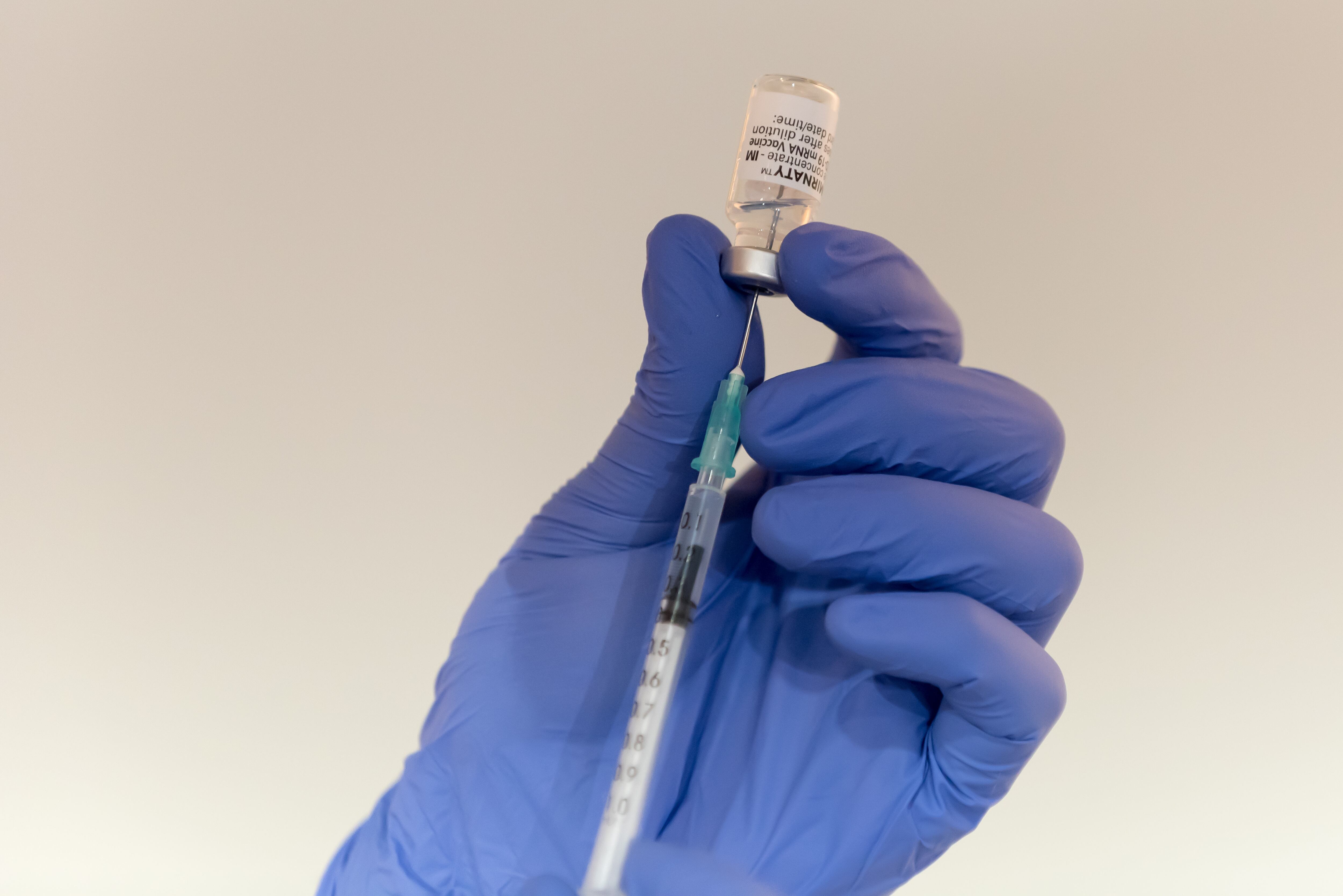 PRAGUE, CZECH REPUBLIC - 2021/12/13: A health worker fills an injection with Comirnaty covid-19 Vaccine.New vaccination center opens in Prague in order to speed up covid-19 vaccination in the Czech Republic. (Photo by Tomas Tkacik/SOPA Images/LightRocket via Getty Images)