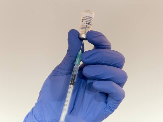 PRAGUE, CZECH REPUBLIC - 2021/12/13: A health worker fills an injection with Comirnaty covid-19 Vaccine.New vaccination center opens in Prague in order to speed up covid-19 vaccination in the Czech Republic. (Photo by Tomas Tkacik/SOPA Images/LightRocket via Getty Images)