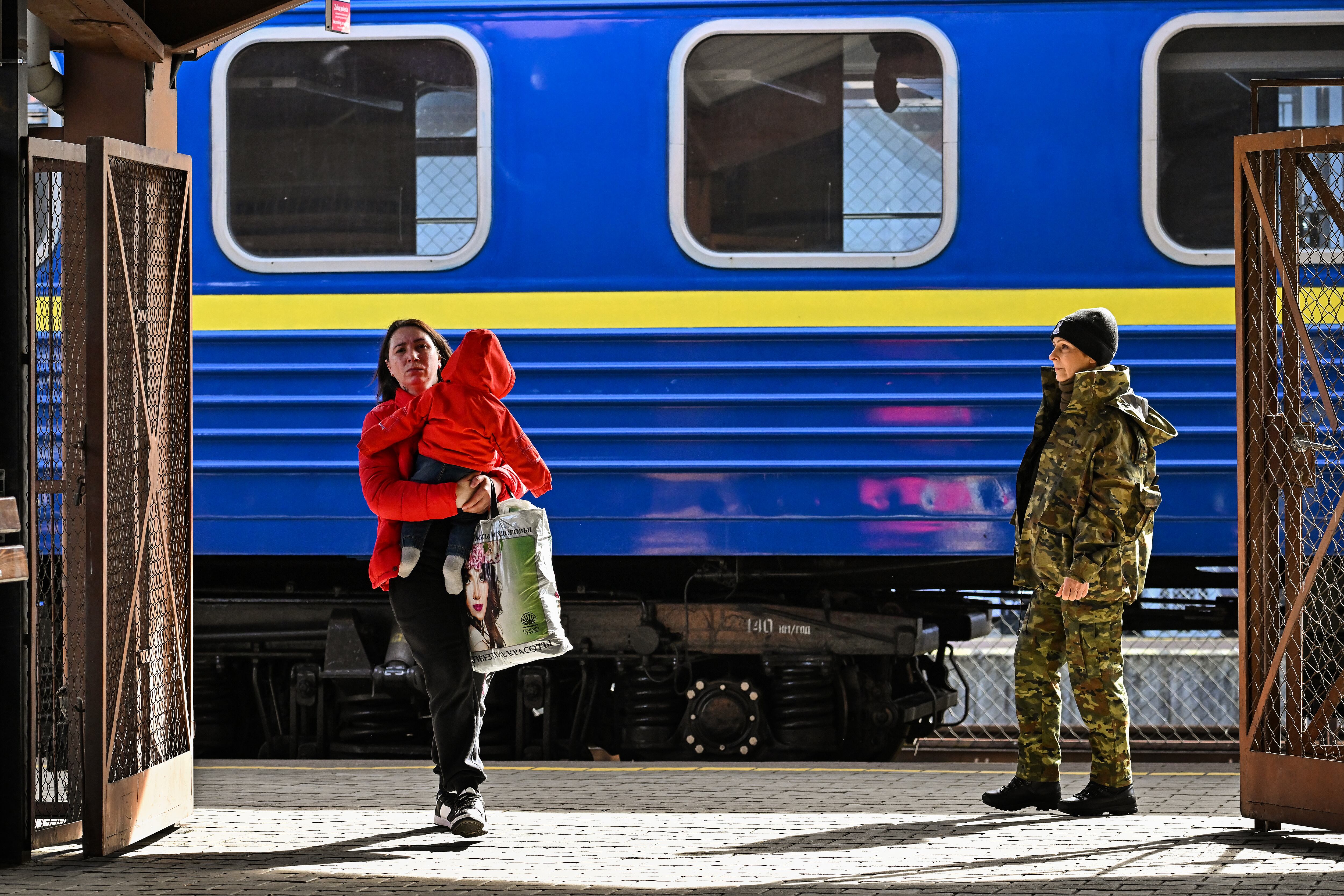 PREZEMYSL, POLAND - MARCH 27: People, mainly women and children, arrive at Przemysl on a train from Odesa station after journeying from war-torn Ukraine on March 27, 2022 in Prezemyls, Poland. Poland has received almost two thirds of the more than 3.5 million people who fled Ukraine after the Feb. 24 invasion by Russia. (Photo by Jeff J Mitchell/Getty Images)