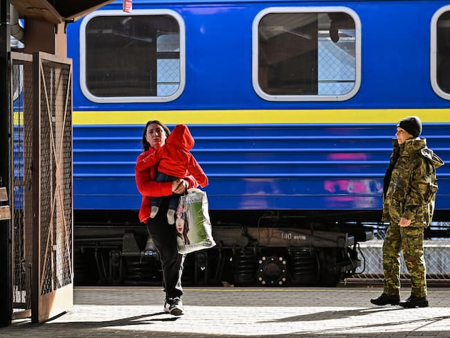 PREZEMYSL, POLAND - MARCH 27: People, mainly women and children, arrive at Przemysl on a train from Odesa station after journeying from war-torn Ukraine on March 27, 2022 in Prezemyls, Poland. Poland has received almost two thirds of the more than 3.5 million people who fled Ukraine after the Feb. 24 invasion by Russia. (Photo by Jeff J Mitchell/Getty Images)