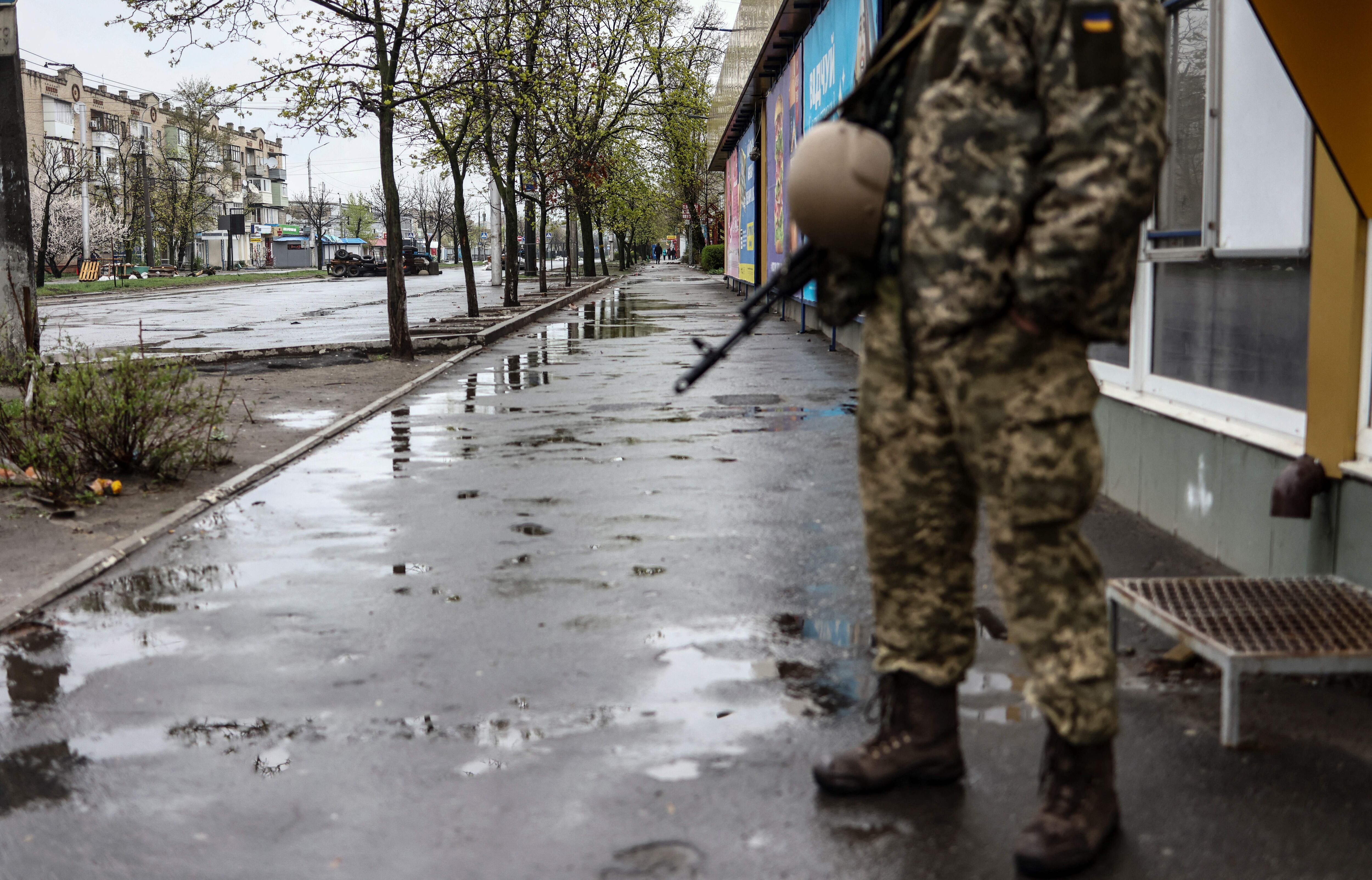 A soldiers stands in a street in Severodonetsk, in eastern Ukraine's Donbass region, on April 13, 2022 as Russian troops intensified a campaign to take the strategic port city of Mariupol, part of an anticipated massive onslaught across eastern Ukraine. (Photo by RONALDO SCHEMIDT / AFP) (Photo by RONALDO SCHEMIDT/AFP via Getty Images)
