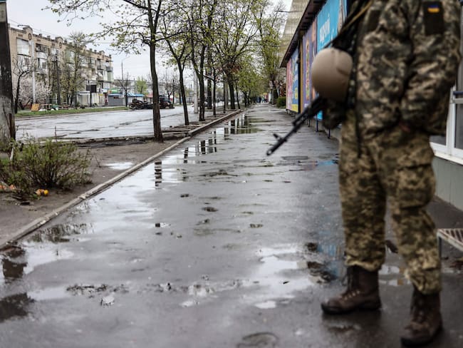 A soldiers stands in a street in Severodonetsk, in eastern Ukraine's Donbass region, on April 13, 2022 as Russian troops intensified a campaign to take the strategic port city of Mariupol, part of an anticipated massive onslaught across eastern Ukraine. (Photo by RONALDO SCHEMIDT / AFP) (Photo by RONALDO SCHEMIDT/AFP via Getty Images)
