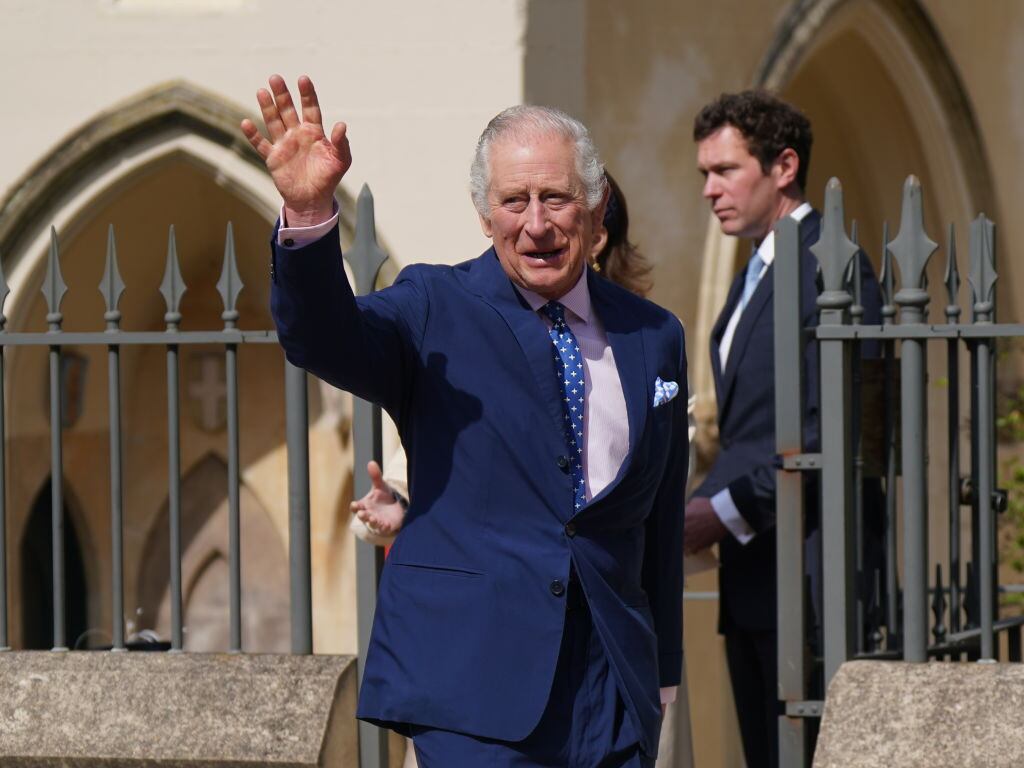 WINDSOR, ENGLAND - APRIL 09: King Charles III waves to wellwishers after attending the Easter Mattins Service at Windsor Castle on April 9, 2023 in Windsor, England. (Photo by Yui Mok - WPA Pool/Getty Images)