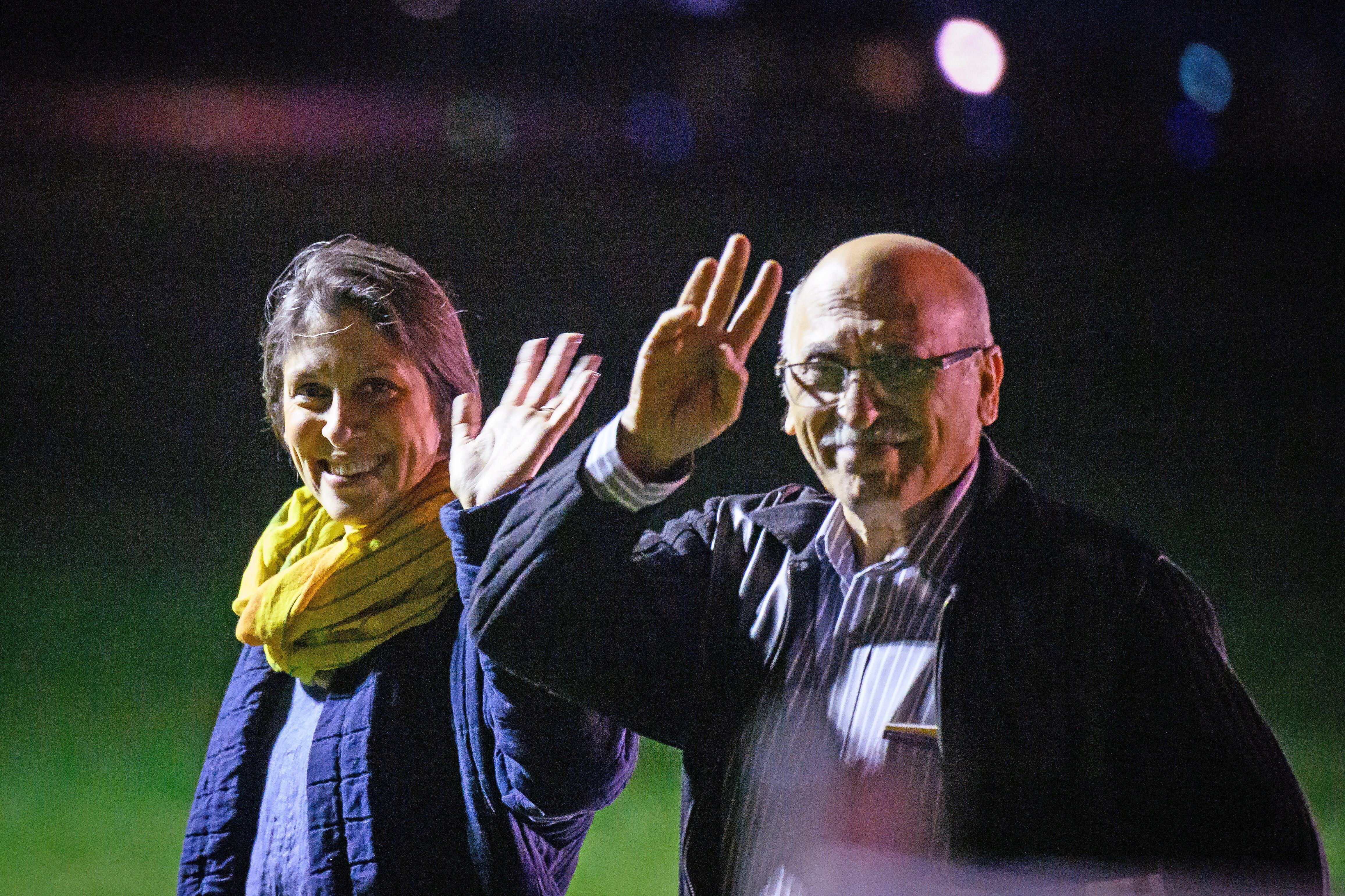 BRIZE NORTON, ENGLAND - MARCH 17: Nazanin Zaghari-Ratcliffe (L) and Anoosheh Ashoori, who were freed from Iran, wave after landing at RAF Brize Norton on March 17, 2022 in Brize Norton, England. Today the British government repaid the Iranian Government almost £400 million owed from a 1979 deal for Chieftain tanks that were never delivered. On their release, Mrs. Zaghari-Ratcliffe and Mr. Ashoori flew first from Tehran to Muscat, Oman then on to RAF Brize Norton on a UK government-chartered Titan Airways Boeing. (Photo by Leon Neal/Getty Images)