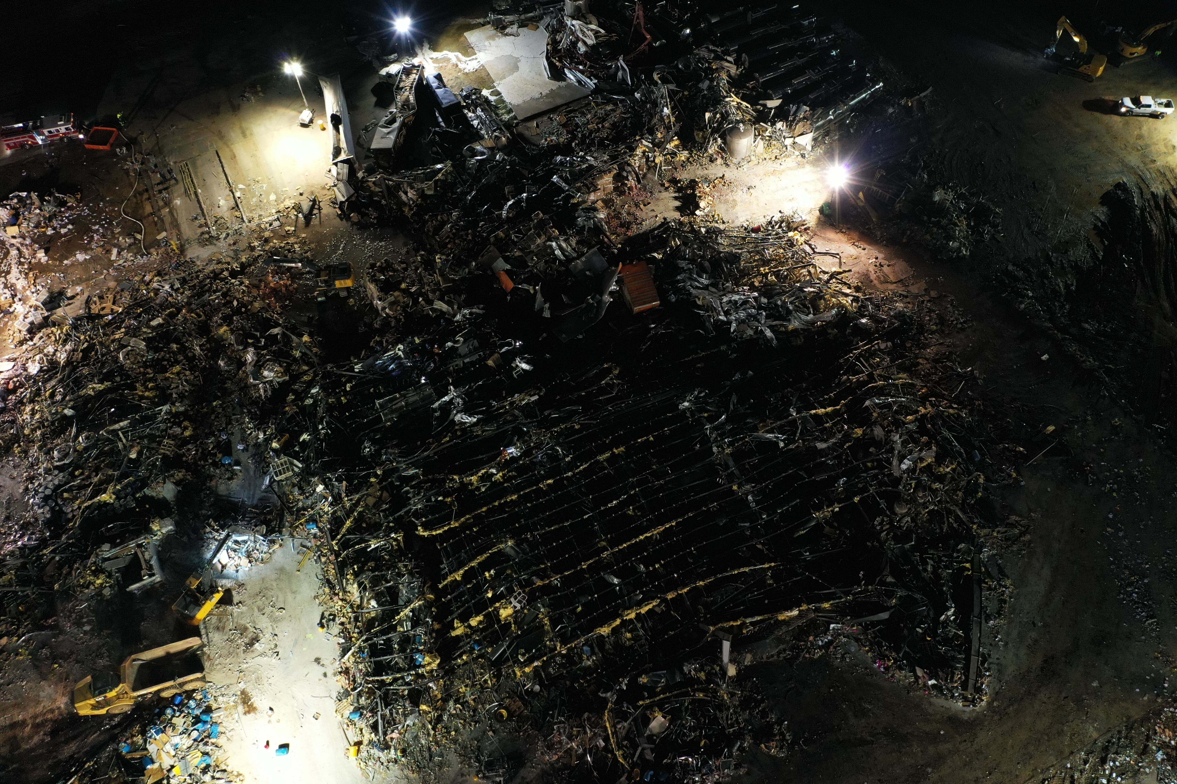 MAYFIELD, KENTUCKY - DECEMBER 12: An aerial view of debris and structural damage is seen at the Mayfield Consumer Products candle factory as search and rescue operations underway after tornado hit Mayfield, Kentucky on December 12, 2021. (Photo by Tayfun Coskun/Anadolu Agency via Getty Images)