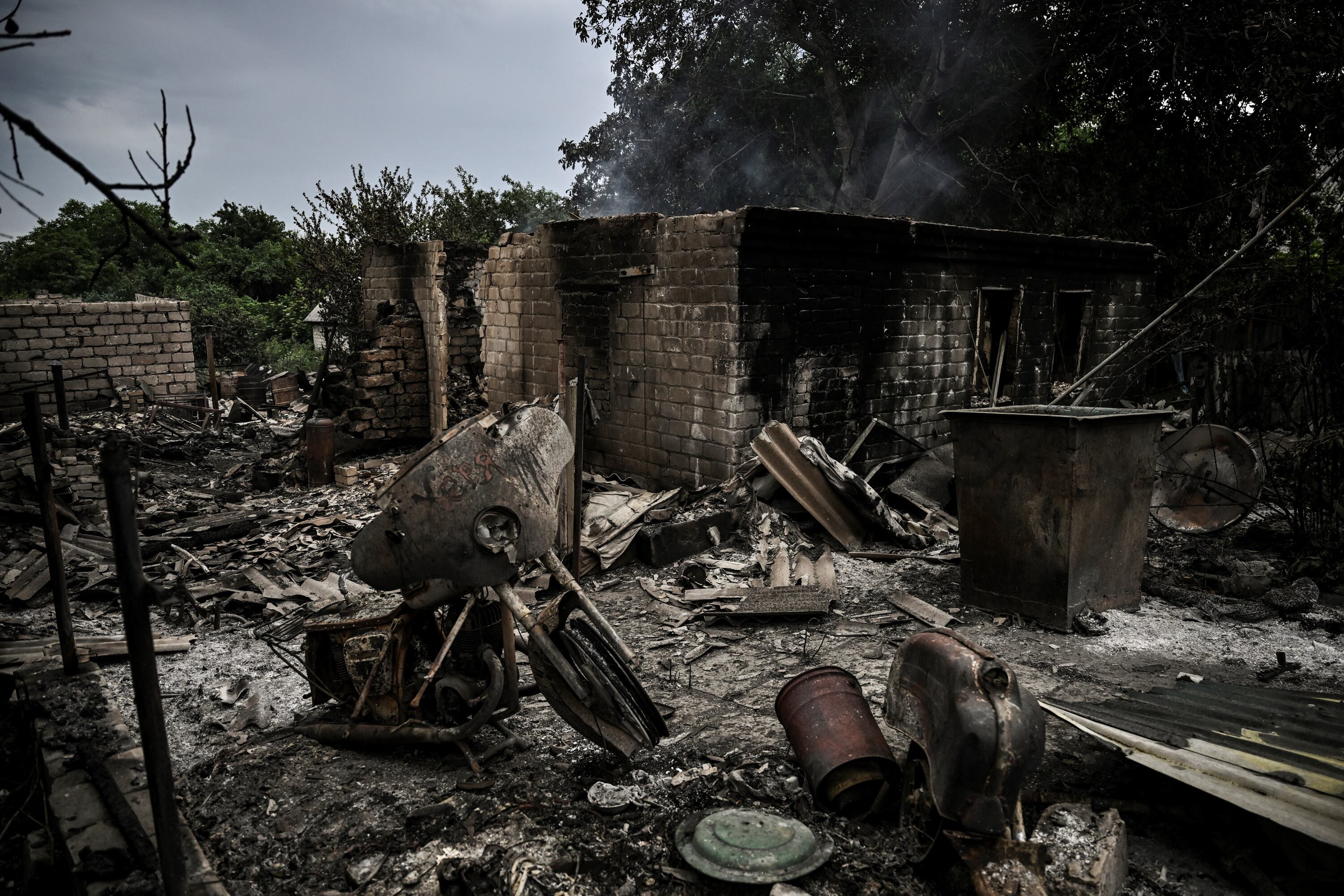 TOPSHOT - A totally destroyed house is pictured after shelling in the city of Lysychansk in the eastern Ukrainian region of Donbas on June 13, 2022, amid Russian invasion of Ukraine. - The cities of Severodonetsk and Lysychansk, which are separated by a river, have been targeted for weeks as the last areas still under Ukrainian control in the eastern Lugansk region. (Photo by ARIS MESSINIS / AFP) (Photo by ARIS MESSINIS/AFP via Getty Images)