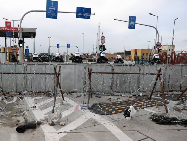 GRODNO REGION, BELARUS - NOVEMBER 22, 2021: A Polish police force are seen behind a barbed wire fence at Kuznica Bialostocka-Bruzgi border crossing on the Belarusian-Polish border. The migrant crisis on the border of Belarus with Poland, Lithuania, and Latvia escalated on November 8. This year, Polish border guards have prevented more than 35,000 attempts to illegally cross the Polish-Belarusian border, which is 400 times more than last year. Sergei Bobylev/TASS (Photo by Sergei Bobylev\TASS via Getty Images)