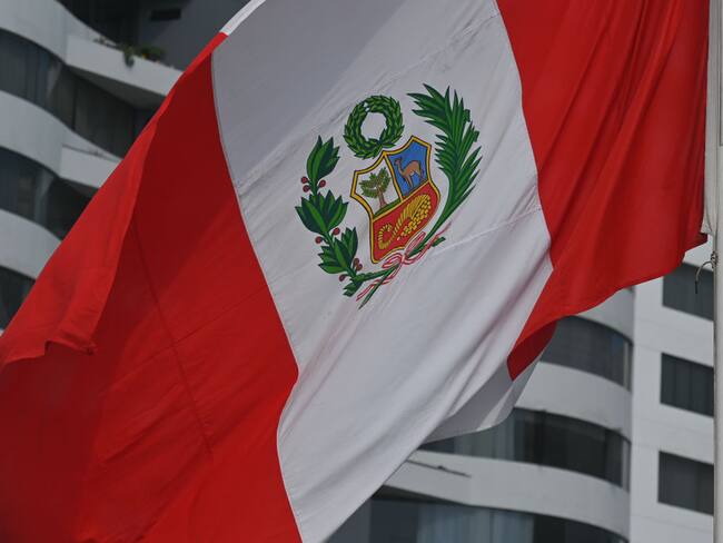 The flag of Peru seen in the Miraflores district of Lima.On Sunday, 27 March 2022, in Lima, Peru. (Photo by Artur Widak/NurPhoto via Getty Images)