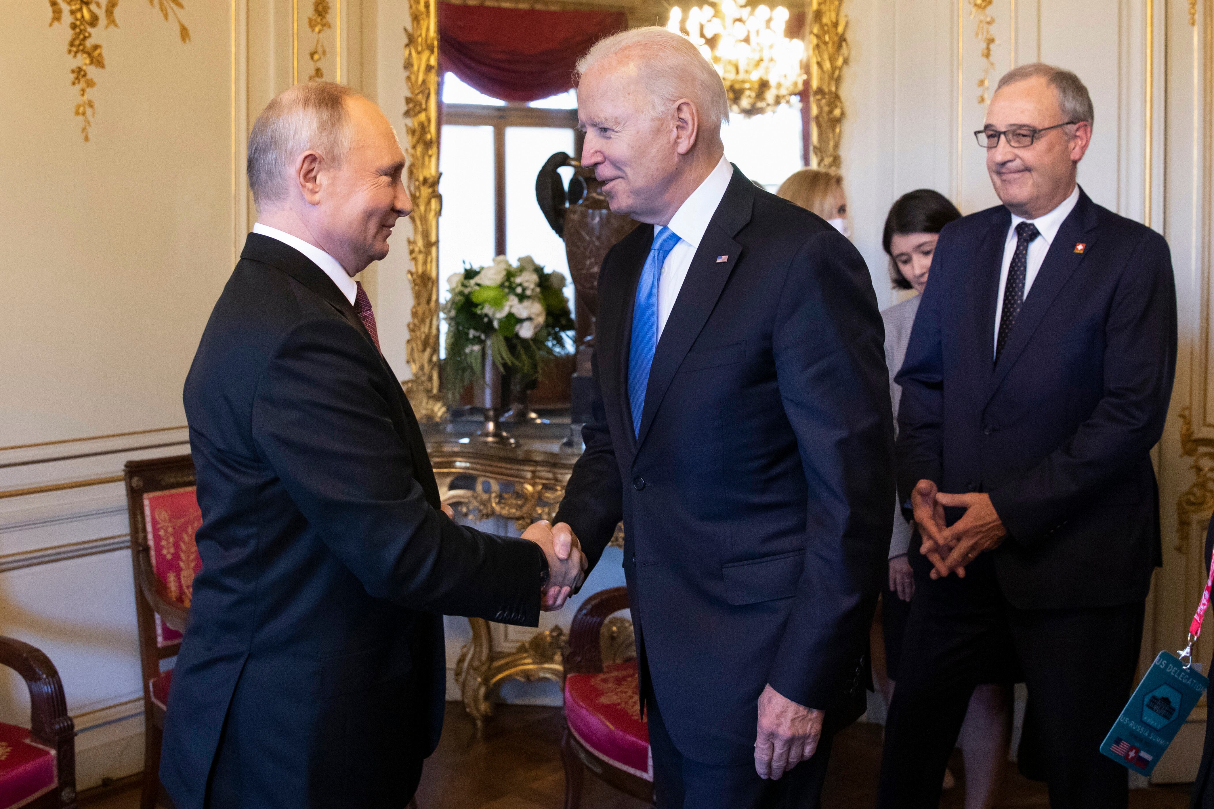 GENEVA, SWITZERLAND - JUNE 16: U.S. President Joe Biden (2L) and Russian President Vladimir Putin shake hands as Swiss President Guy Parmelin (R) looks on during the U.S.-Russia summit at Villa La Grange on June 16, 2021 in Geneva, Switzerland. Biden is meeting his Russian counterpart, Putin, for the first time as president in Geneva, Switzerland. (Photo by Peter Klaunzer - Pool/Keystone via Getty Images)