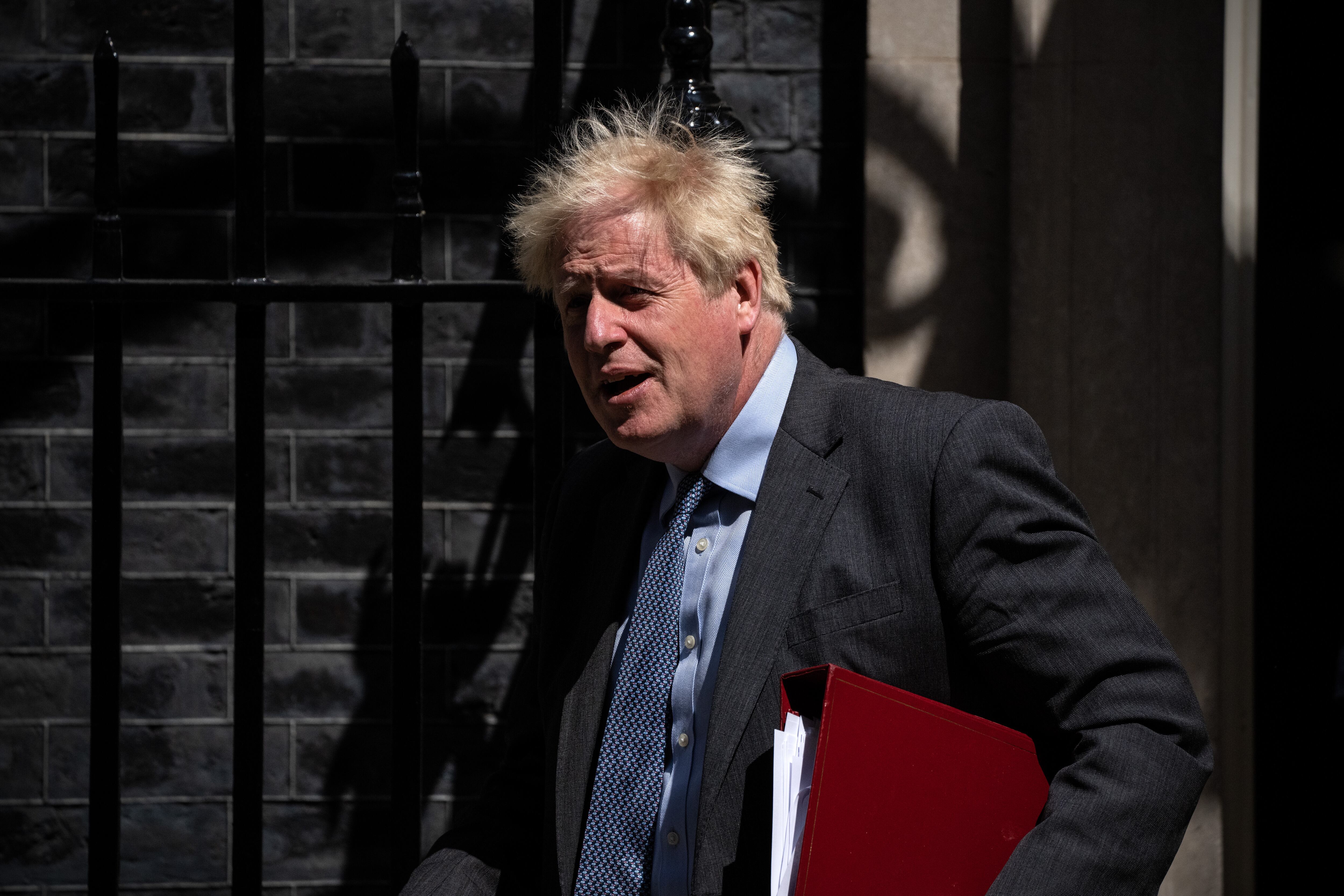 LONDON, ENGLAND - JUNE 15: Britain's Prime Minister, Boris Johnson, leaves to attend Prime Minister's Questions in the House of Commons on June 15, 2022 in London, England. Johnson is expected to take questions from MPs after the European Court Of Human Rights grounded yesterday's government flight carrying asylum seekers to Rwanda. (Photo by Carl Court/Getty Images)