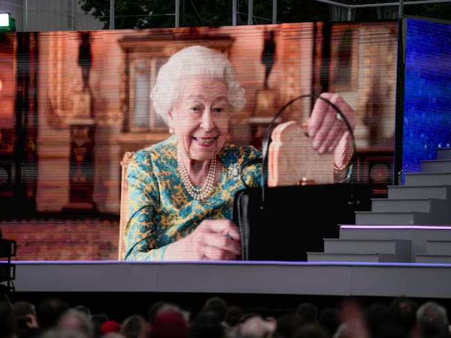 LONDON, ENGLAND - JUNE 04: Queen Elizabeth II is seen onscreen during the Platinum Party At The Palace at Buckingham Palace on June 4, 2022 in London, England. The Platinum Jubilee of Elizabeth II is being celebrated from June 2 to June 5, 2022, in the UK and Commonwealth to mark the 70th anniversary of the accession of Queen Elizabeth II on 6 February 1952. (Photo by Alastair Grant - WPA Pool/Getty Images)