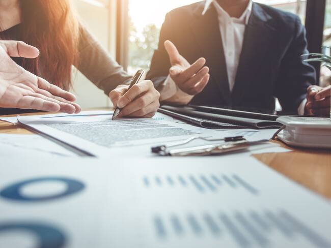 Business Signing a Contract Buy - sell house.