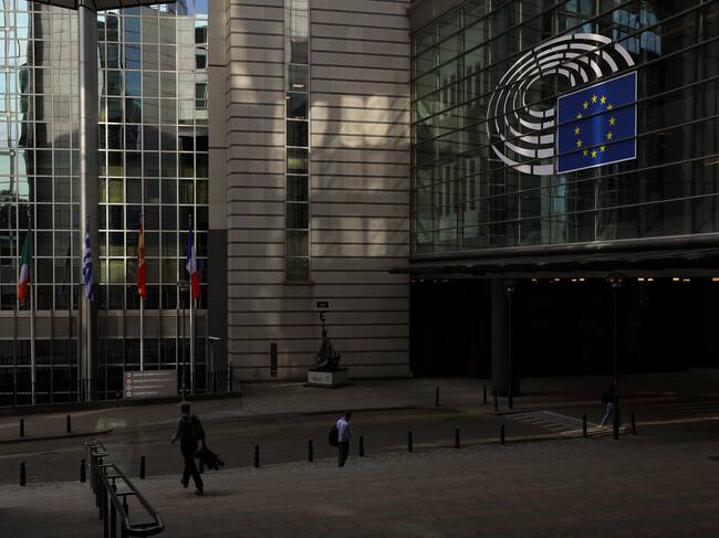 People go to work early in the morning past the European Parliament in Brussels. Belgium, Wednesday, July 6th, 2022. (Photo by Danil Shamkin/NurPhoto via Getty Images)