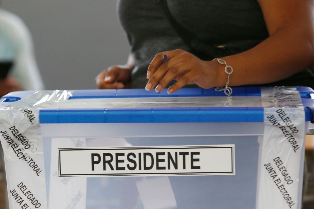 PAINE, CHILE - DECEMBER 19: A Chilean woman casts her vote during presidential elections runoff in Paine on December 19, 2021 in Paine, Chile. (Photo by Marcelo Hernandez/Getty Images)