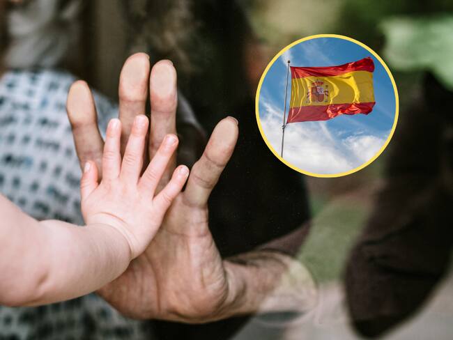 Niña intentando tocar la mano de su abuelo a través de la ventana / Bandera de España (Getty Images)