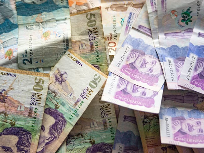 A lot of colombian baknotes of different denominations like $50.000, $20.000 and $2.000