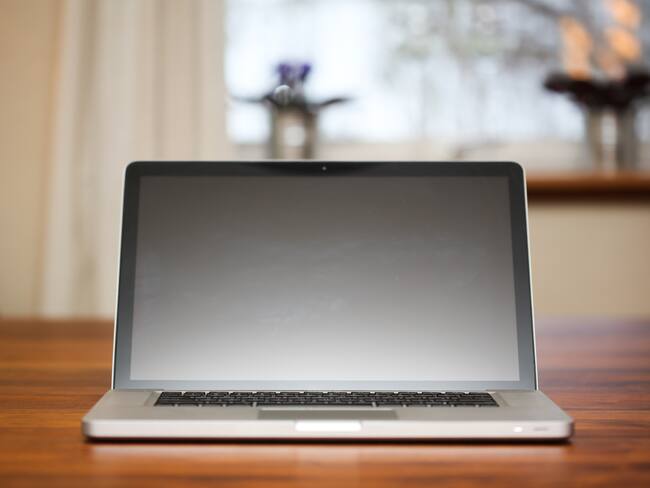 Bergen, Norway – December 13, 2012: A 2012 Macbook Pro, opened, on a desktop. Many Mac users consider the 2012-2015 models to be the best laptops ever made by Apple.