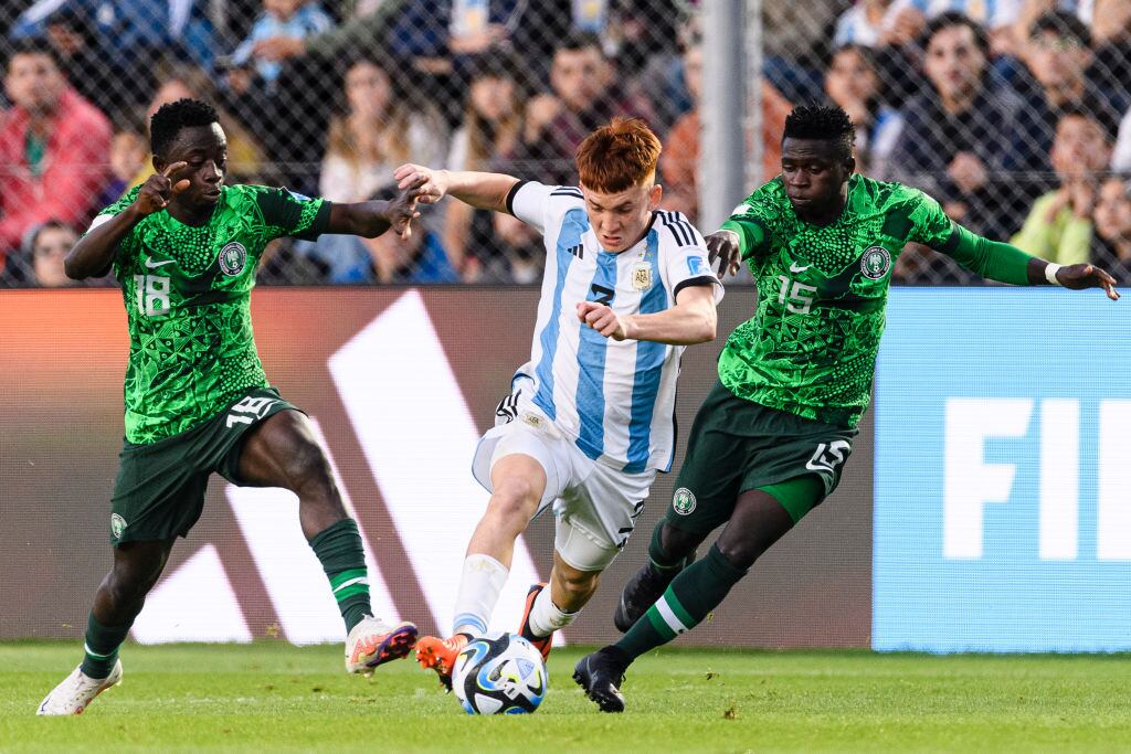 SAN JUAN, ARGENTINA - MAY 31: Valentin Barco of Argentina (C) plays against Jude Sunday of Nigeria (R) during FIFA U-20 World Cup Argentina 2023 Round of 16 match between Argentina and Nigeria at Estadio San Juan on May 31, 2023 in San Juan, Argentina. (Photo by Marcio Machado/Eurasia Sport Images/Getty Images)