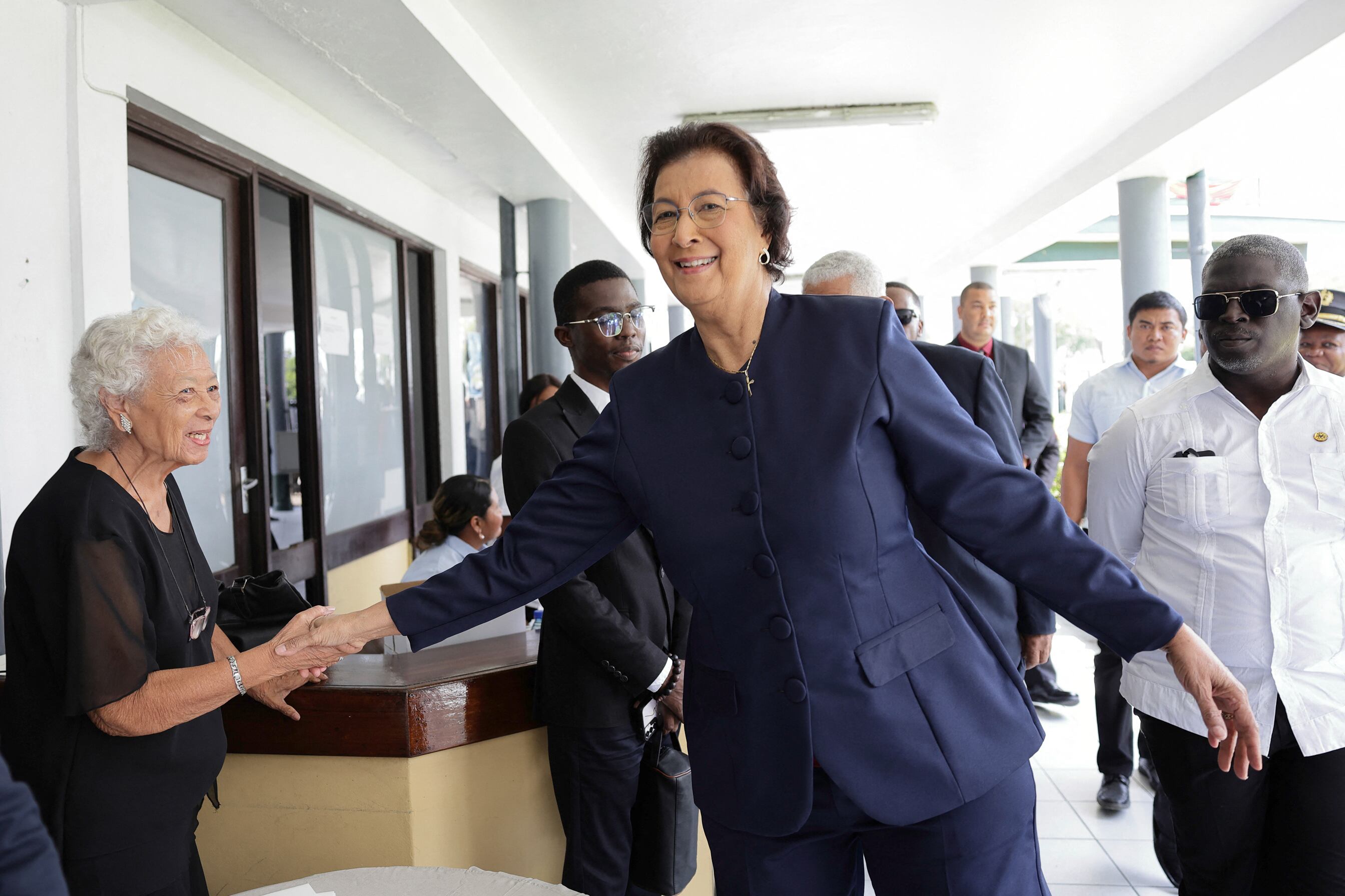 Suriname's opposition leader Jennifer Geerlings-Simons greets a woman after the National Assembly election in Paramaribo on July 6, 2025. Lawmakers elected Jennifer Geerlings-Simons as Suriname's first woman president on July 6, 2025, after her party won the most seats in legislative elections in May. (Photo by Ranu Abhelakh / AFP) (Photo by RANU ABHELAKH/AFP via Getty Images)          