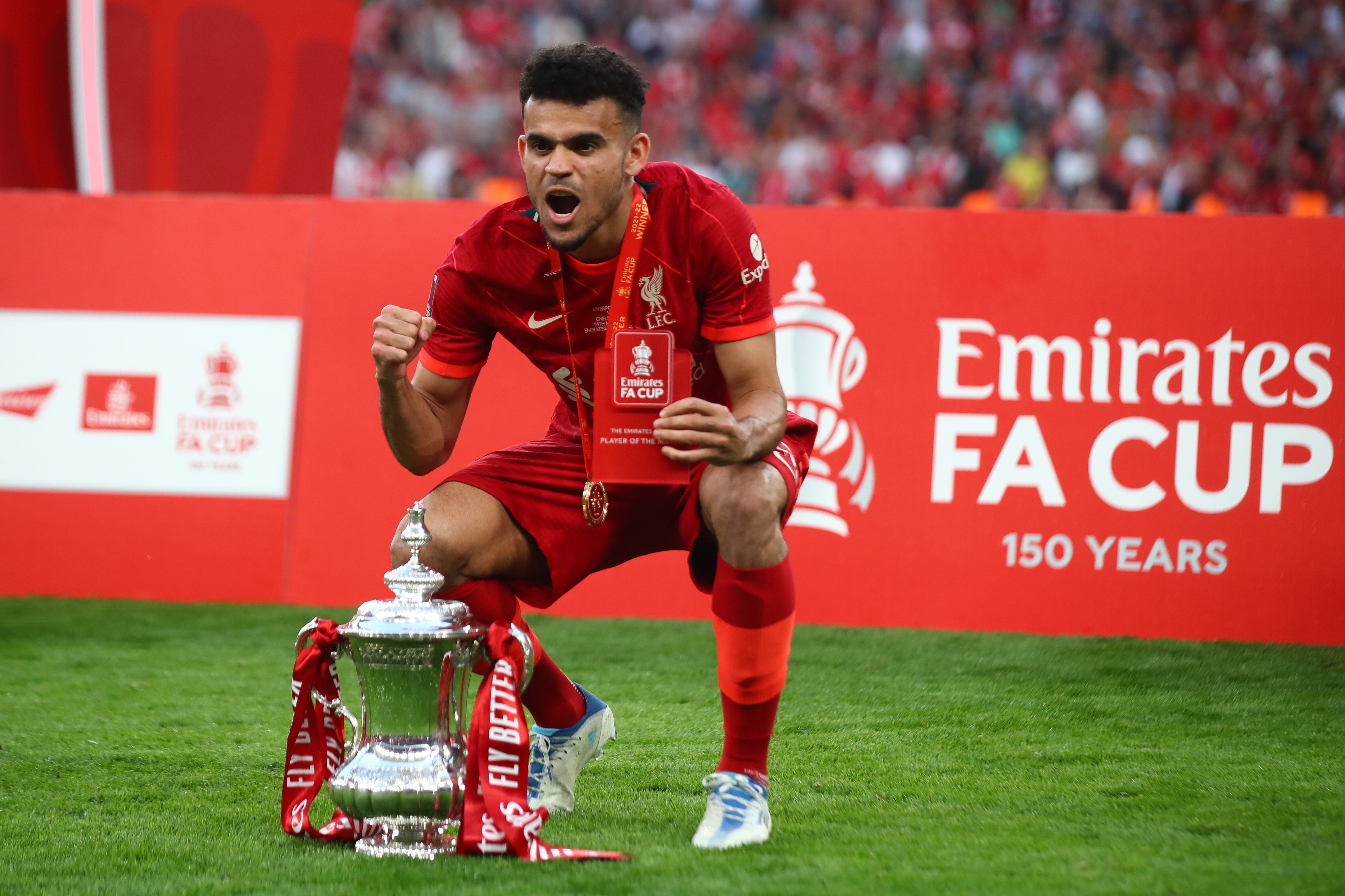 LONDON, ENGLAND - MAY 14:   Luis Diaz of Liverpool celebrates with the trophy following his sides victory in a penalty shootout during The FA Cup Final match between Chelsea and Liverpool at Wembley Stadium on May 14, 2022 in London, England. (Photo by Chris Brunskill/Fantasista/Getty Images)