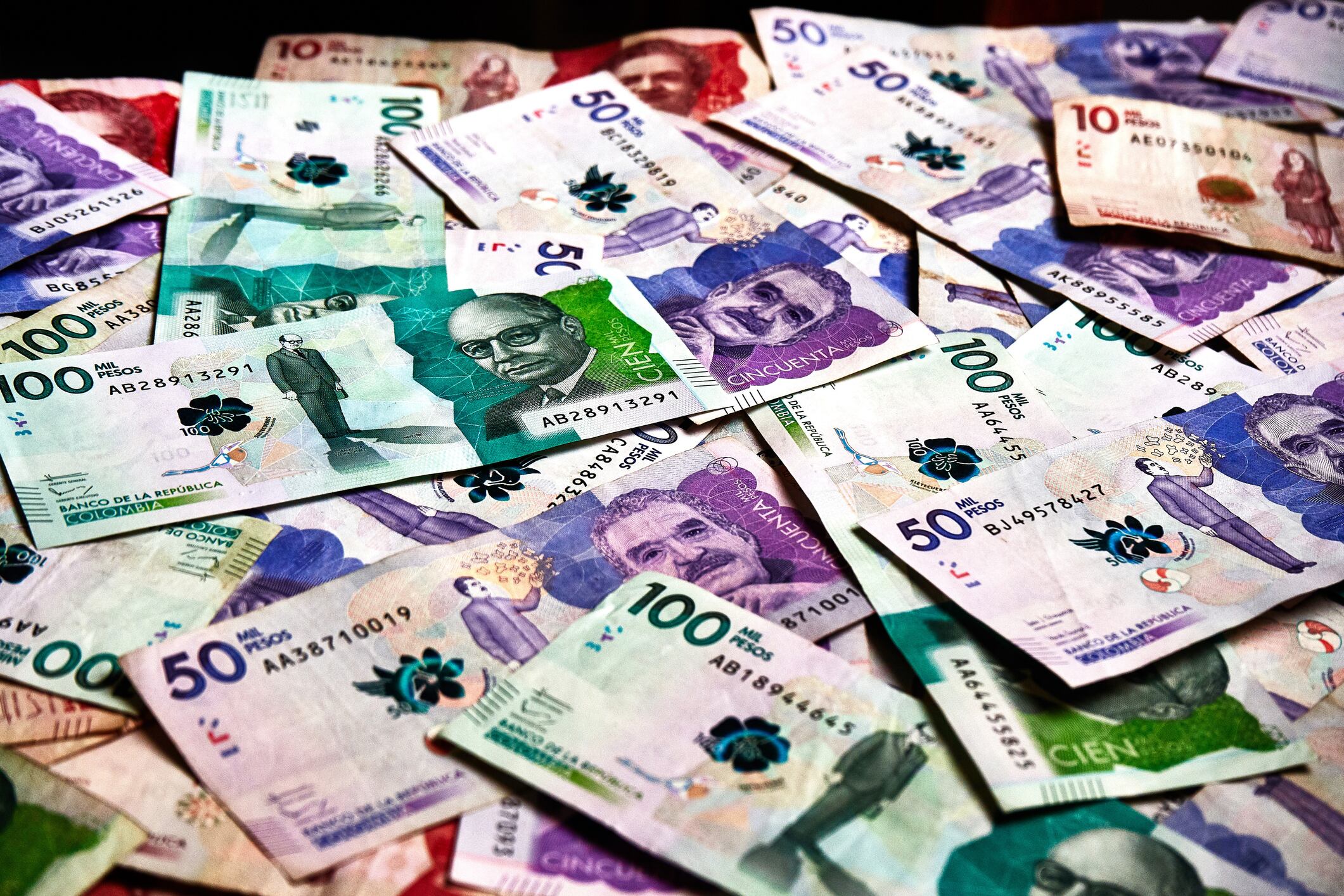 Table full of colombian banknotes of various denominations that serve to stop the salaries of workers, make commercial transactions and sell and buy any type of article