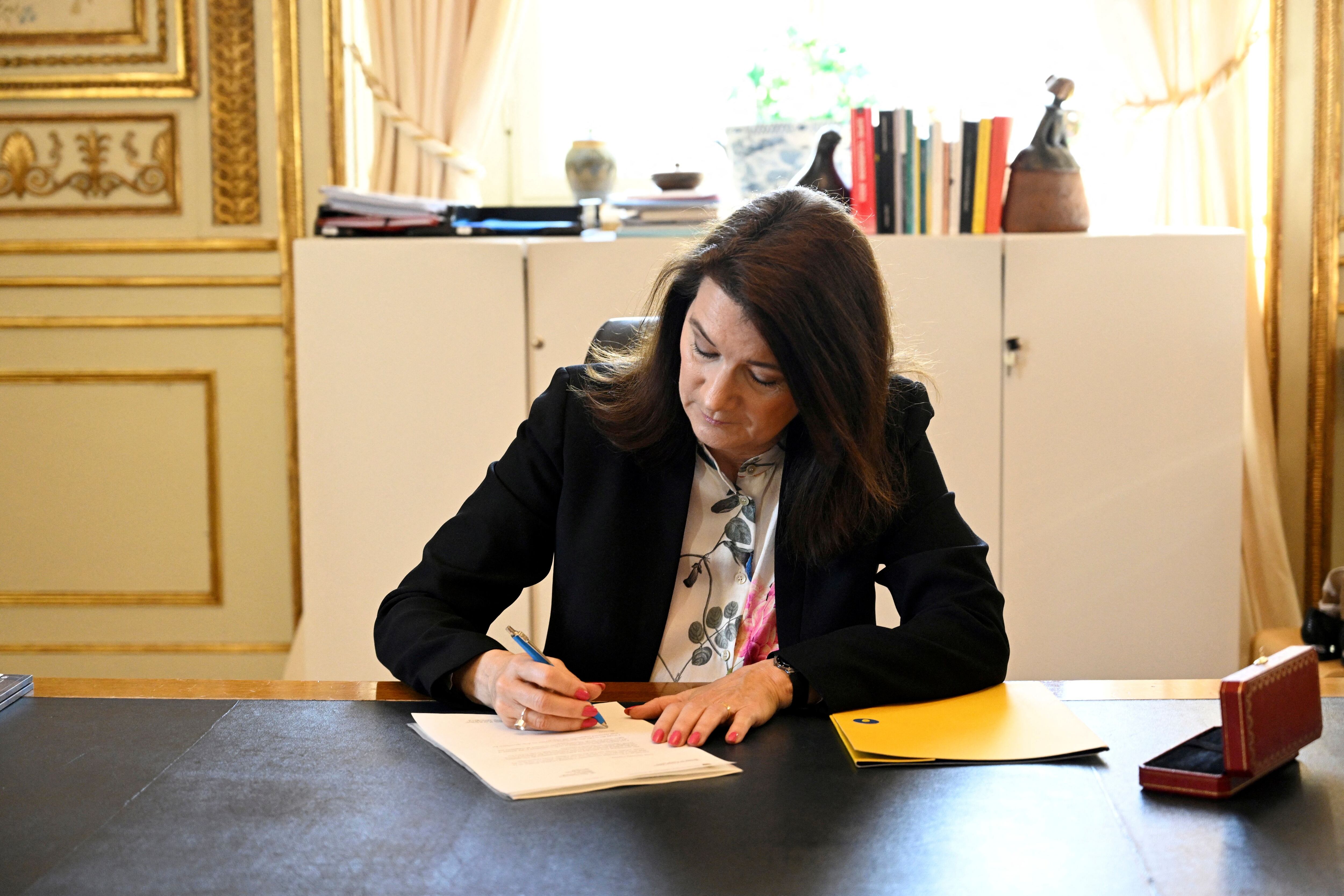 Sweden's Minister of Foreígn Affairs Ann Linde signs Sweden's application for NATO membership at the Ministry of Foreign Affairs in Stockholm, Sweden, on May 17, 2022. - Sweden OUT (Photo by Henrik MONTGOMERY / TT News Agency / AFP) / Sweden OUT (Photo by HENRIK MONTGOMERY/TT News Agency/AFP via Getty Images)
