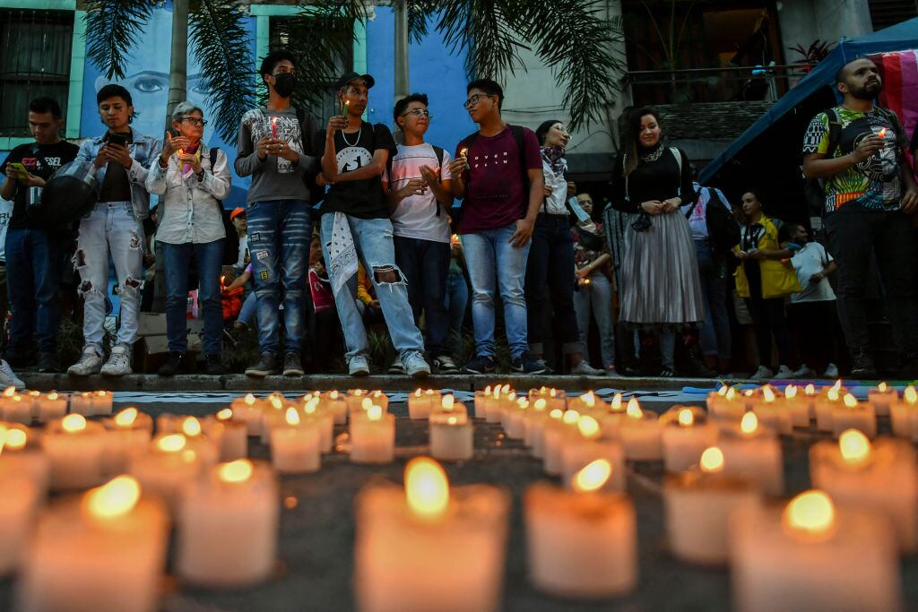 People take part in an homage to remember the victims of hate crimes against the LGBTI community in Medellin, Colombia on April 5, 2022. - Six members of the LGBTI community were murdered this year in the Colombian city of Medellin, a number that already exceeds all cases in 2021, authorities warned Tuesday, linking the wave of violence to the gay dating app Grindr. (Photo by JOAQUIN SARMIENTO / AFP) (Photo by JOAQUIN SARMIENTO/AFP via Getty Images)