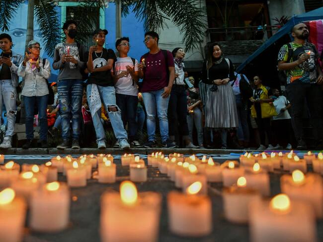 People take part in an homage to remember the victims of hate crimes against the LGBTI community in Medellin, Colombia on April 5, 2022. - Six members of the LGBTI community were murdered this year in the Colombian city of Medellin, a number that already exceeds all cases in 2021, authorities warned Tuesday, linking the wave of violence to the gay dating app Grindr. (Photo by JOAQUIN SARMIENTO / AFP) (Photo by JOAQUIN SARMIENTO/AFP via Getty Images)