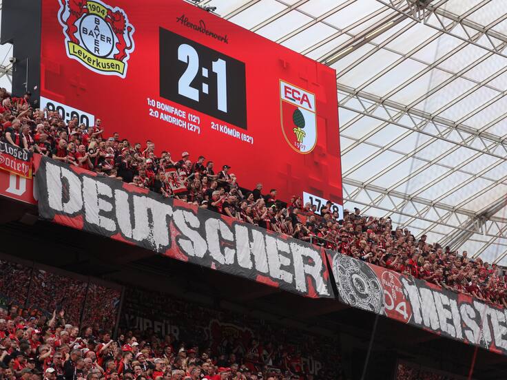 Leverkusen (Germany), 18/05/2024.- Supporters of Leverkusen show a banner reading &#039;German Champion&#039; after the German Bundesliga soccer match of Bayer 04 Leverkusen against FC Augsburg, in Leverkusen, Germany, 18 May 2024. (Alemania) EFE/EPA/CHRISTOPHER NEUNDORF CONDITIONS - ATTENTION: The DFL regulations prohibit any use of photographs as image sequences and/or quasi-video.