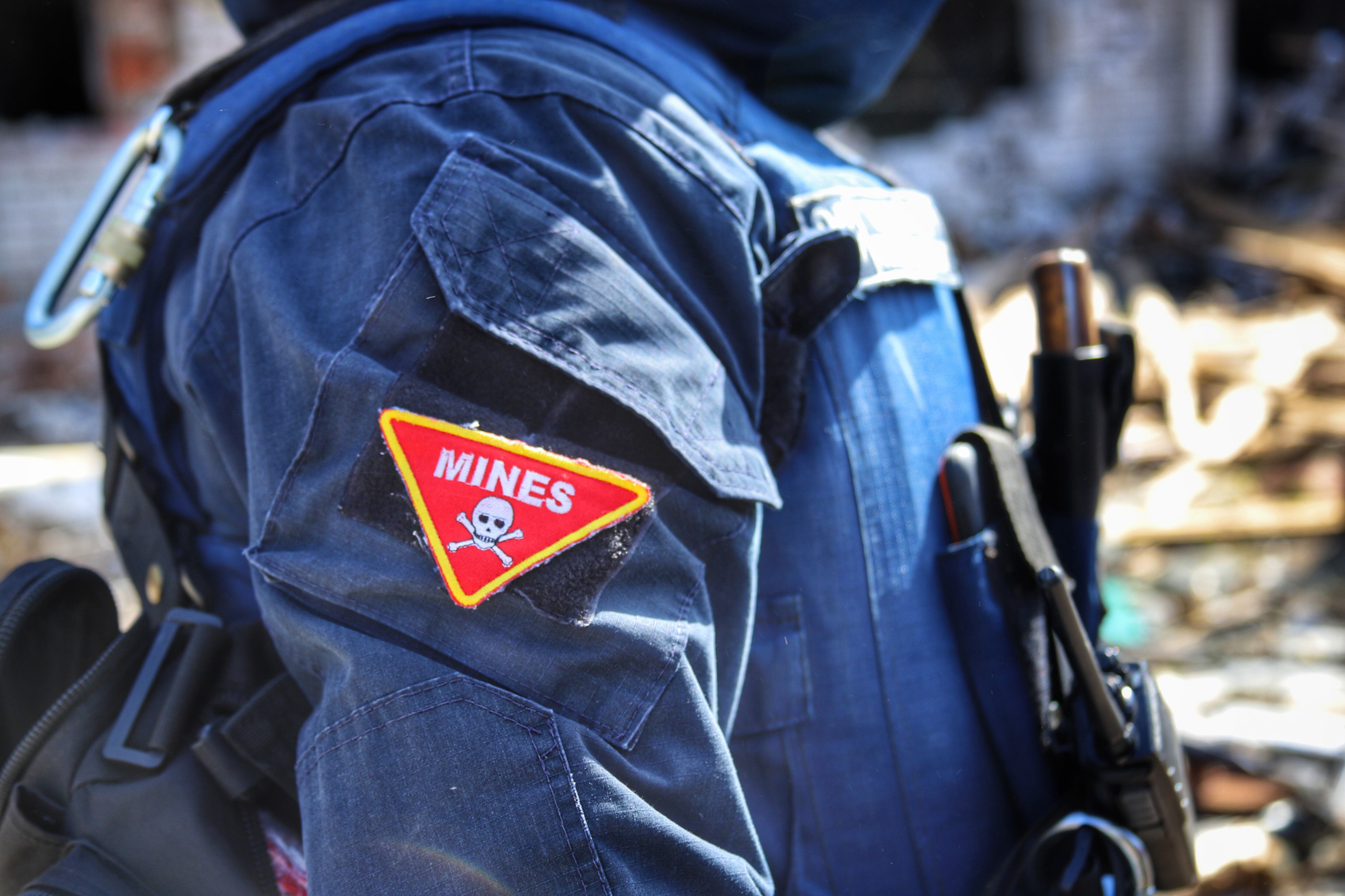NOVOSELIVKA, UKRAINE - APRIL 15, 2022 - A chevron of the State Emergency Service rescuer that reads 'Mines' is pictured in Novoselivka which was liberated from Russian invaders, Chernihiv Region, northern Ukraine. (Photo credit should read Oleksandra Yefymenko/ Ukrinform/Future Publishing via Getty Images)