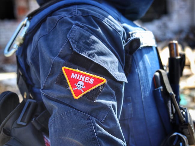 NOVOSELIVKA, UKRAINE - APRIL 15, 2022 - A chevron of the State Emergency Service rescuer that reads 'Mines' is pictured in Novoselivka which was liberated from Russian invaders, Chernihiv Region, northern Ukraine. (Photo credit should read Oleksandra Yefymenko/ Ukrinform/Future Publishing via Getty Images)