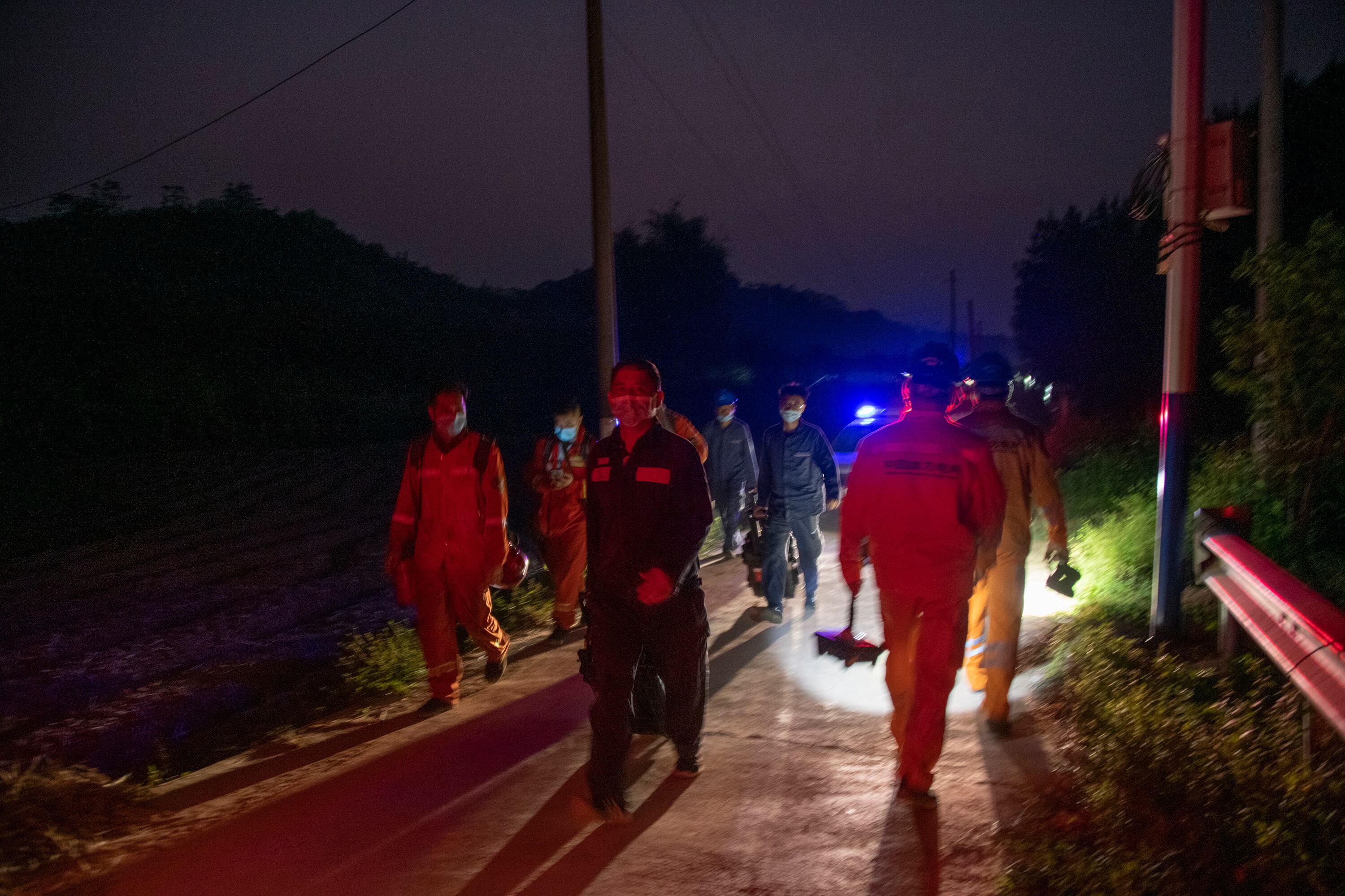 TENGXIAN, CHINA - MARCH 21: Rescuers set up lighting equipment at the site of a plane crash on March 21, 2022 in Tengxian County, Wuzhou City, Guangxi Zhuang Autonomous Region of China. A China Eastern Airlines Boeing 737-800NG aircraft carrying 132 people, including 123 passengers and nine crew members, crashed in South China's Guangxi Zhuang autonomous region on Monday. (Photo by He Huawen/VCG via Getty Images)