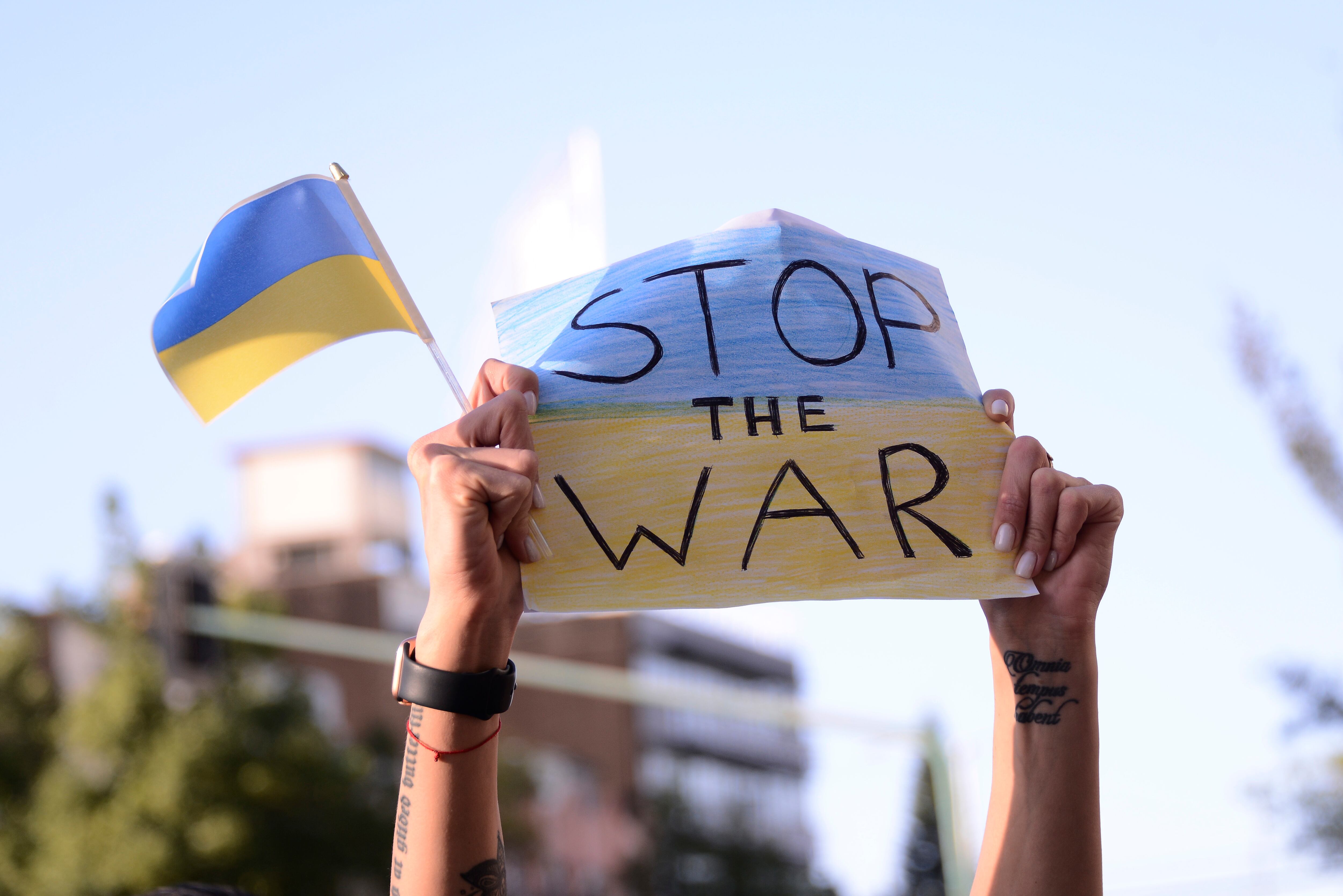 MEXICO CITY, MEXICO - FEB 28, 2022: People with flags and signs demonstrate against the Russian military invasion of Ukraine outside the Russian Federation embassy in Mexico City, on February 28, 2022. (Photo credit should read Carlos Tischler / Eyepix Group/Future Publishing via Getty Images)