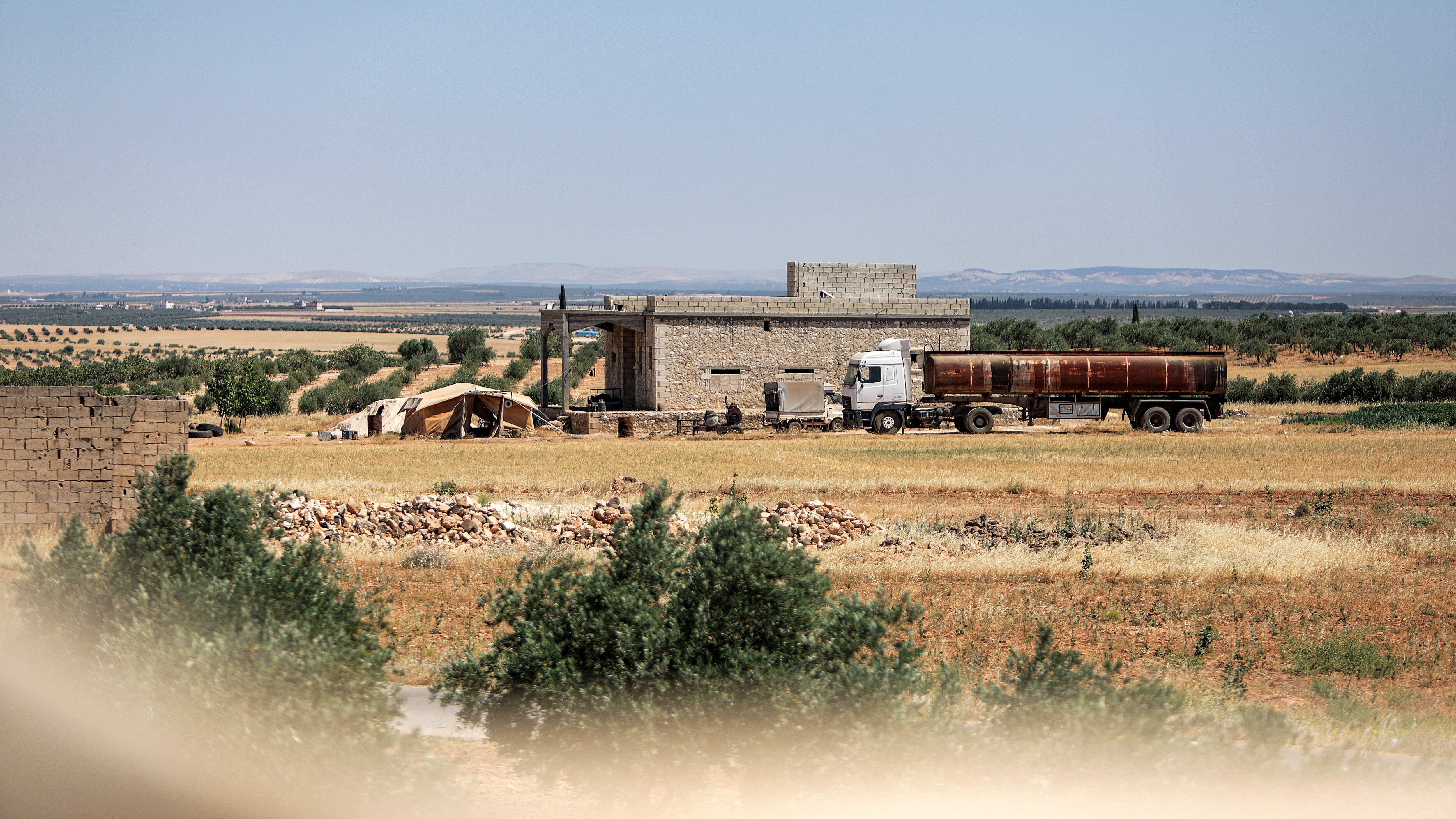 This picture taken on June 16, 2022 shows a view of a building where US coalition forces conducted an overnight airborne operation in the village of Humayra in the Ghandoura district in the north of Syria's Aleppo province. - US coalition forces said they captured a senior Islamic State group bomb maker in an airborne operation before dawn on June 16, 2022 in northern Syria. The Syrian Observatory for Human Rights and AFP correspondents said helicopters touched down for only a few minutes in a village in the area controlled by Turkish-backed rebel groups. The US-led coalition dedicated to battling the jihadist group in the region did not name the target. (Photo by Bakr ALKASEM / AFP) / The erroneous mention[s] appearing in the metadata of this photo by Bakr ALKASEM has been modified in AFP systems in the following manner: [Date: June 16]. Please immediately remove the erroneous mention[s] from all your online services and delete it (them) from your servers. If you have been authorized by AFP to distribute it (them) to third parties, please ensure that the same actions are carried out by them. Failure to promptly comply with these instructions will entail liability on your part for any continued or post notification usage. Therefore we thank you very much for all your attention and prompt action. We are sorry for the inconvenience this notification may cause and remain at your disposal for any further information you may require. (Photo by BAKR ALKASEM/AFP via Getty Images)