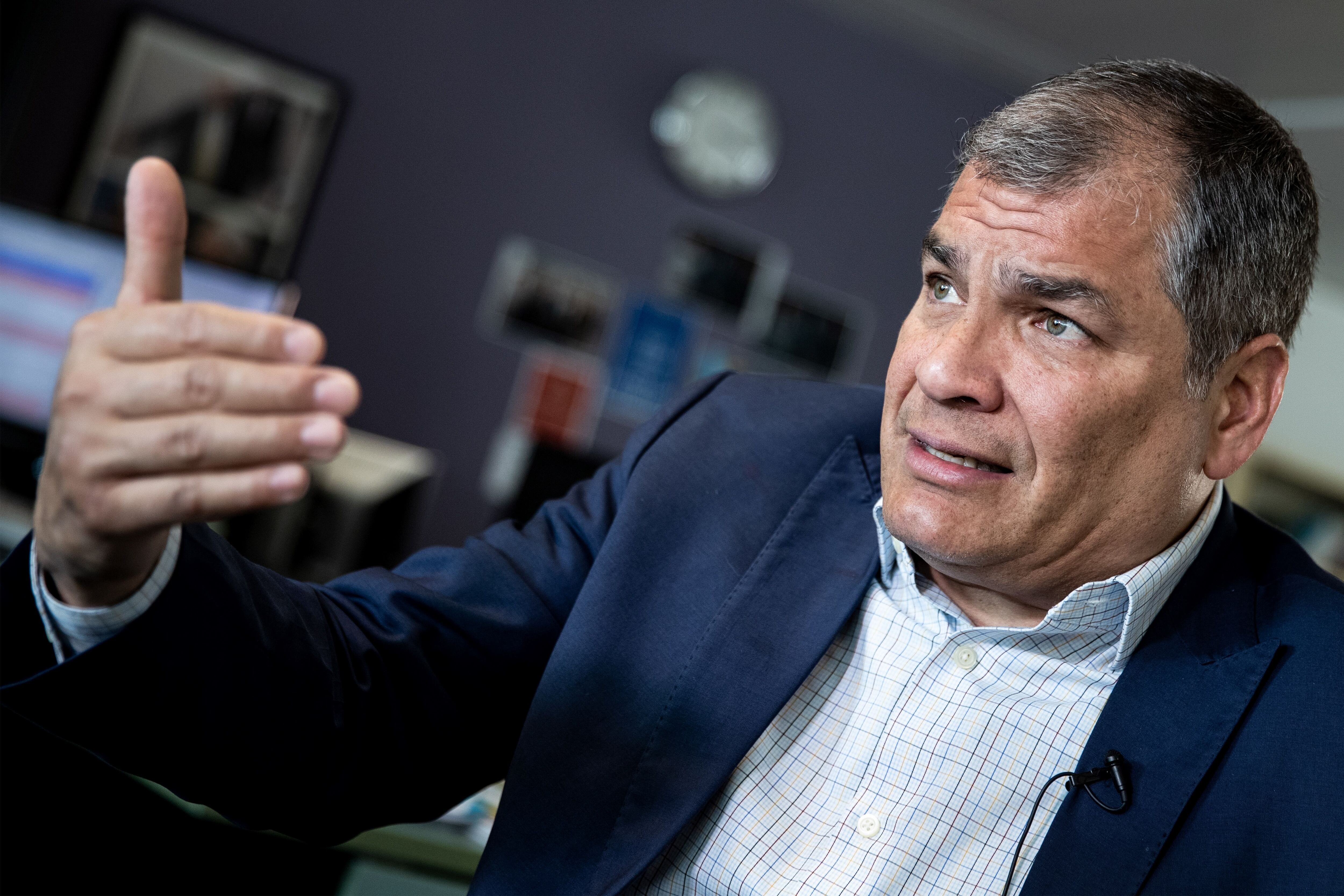 Ecuador's former President (2007-2017) Rafael Correa gestures during an interview with Agence France-Presse (AFP) in Brussels on April 11, 2019 after WikiLeaks founder Julian Assange's nearly seven-year hideout in Ecuador's London embassy abruptly ended today when police entered the building and arrested him ahead of possible extradition to the United States. - Assange is wanted by Britain for violating prior bail conditions -- a minor charge that WikiLeaks fears will be used as a pretext for extraditing him to the United States. There he potentially faces a far more serious case linked to the publication of classified US defence material. Rafael Correa who was instrumental in granting Assange asylum, slammed the reversal of Ecuador policy as "a crime." (Photo by KENZO TRIBOUILLARD / AFP) (Photo credit should read KENZO TRIBOUILLARD/AFP via Getty Images)