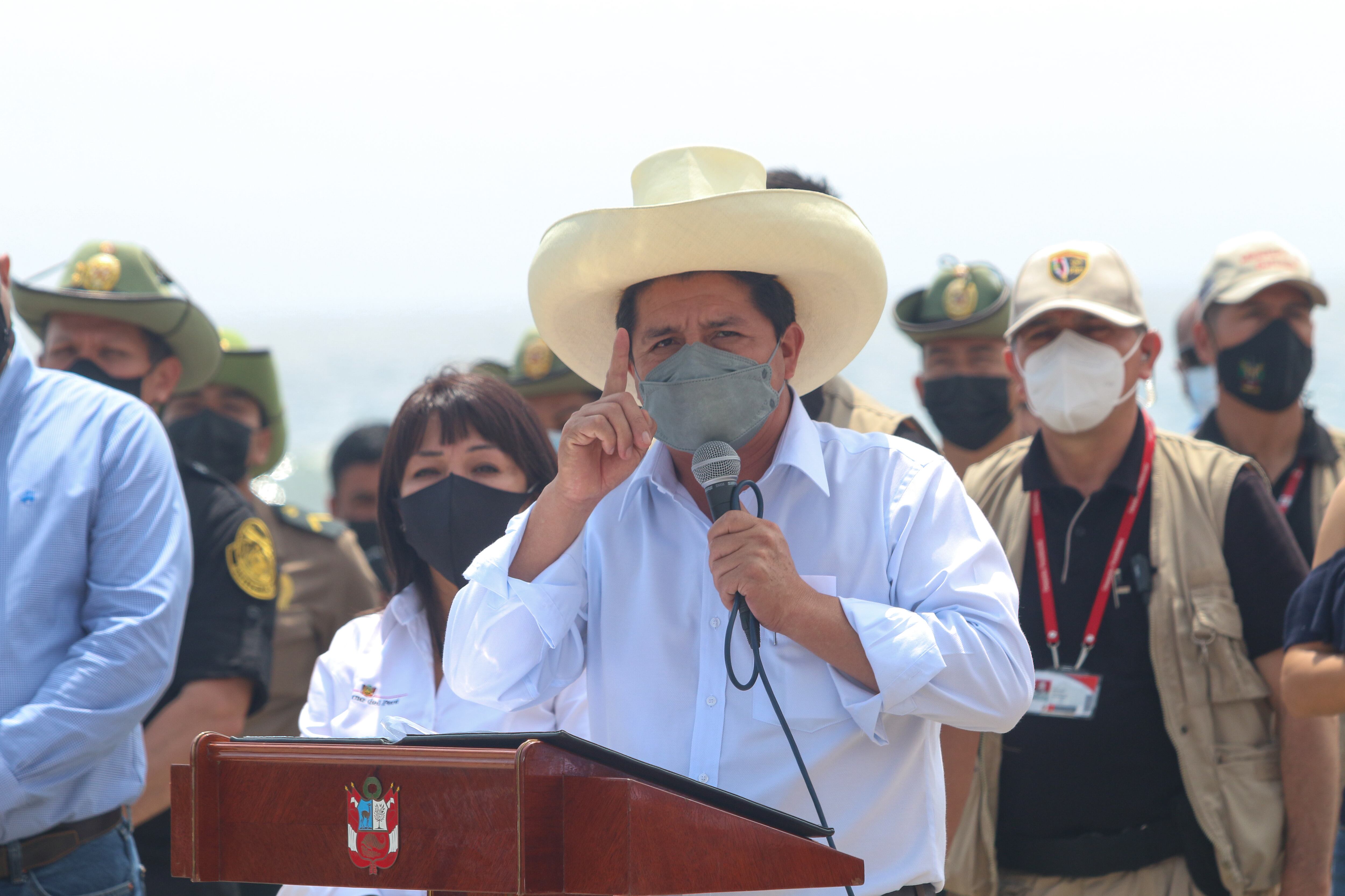 President of Peru Pedro Castillo speaks during the oil spill cleanup in the shore of Cavero Beach on January 20, 2022 in Ventanilla, Peru. (Photo by Marcos Reategui/Getty Images)