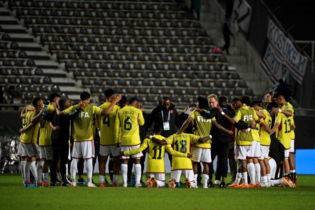 Colombian players pray at the end Argentina 2023 U-20 World Cup Group C football match between Japon and Colombia at the Diego Armando Maradona stadium in La Plata, Argentina, on May 24, 2023. (Photo by LUIS ROBAYO / AFP) (Photo by LUIS ROBAYO/AFP via Getty Images)