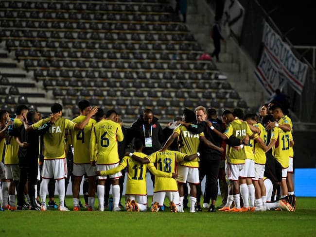 Colombian players pray at the end Argentina 2023 U-20 World Cup Group C football match between Japon and Colombia at the Diego Armando Maradona stadium in La Plata, Argentina, on May 24, 2023. (Photo by LUIS ROBAYO / AFP) (Photo by LUIS ROBAYO/AFP via Getty Images)